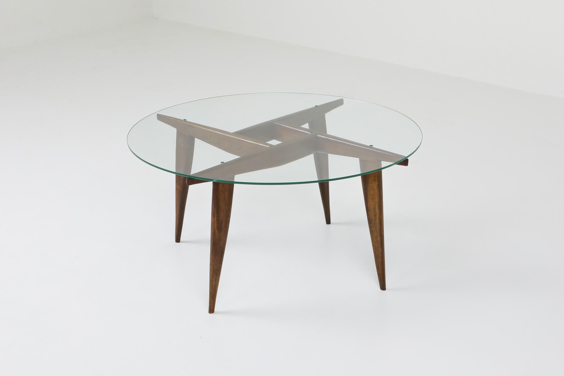 Mid-Century Modern rare and singularly elegant coffee table by Gio Ponti for Singer & Sons, Italy, early 1950s. Solid walnut base with glass top.