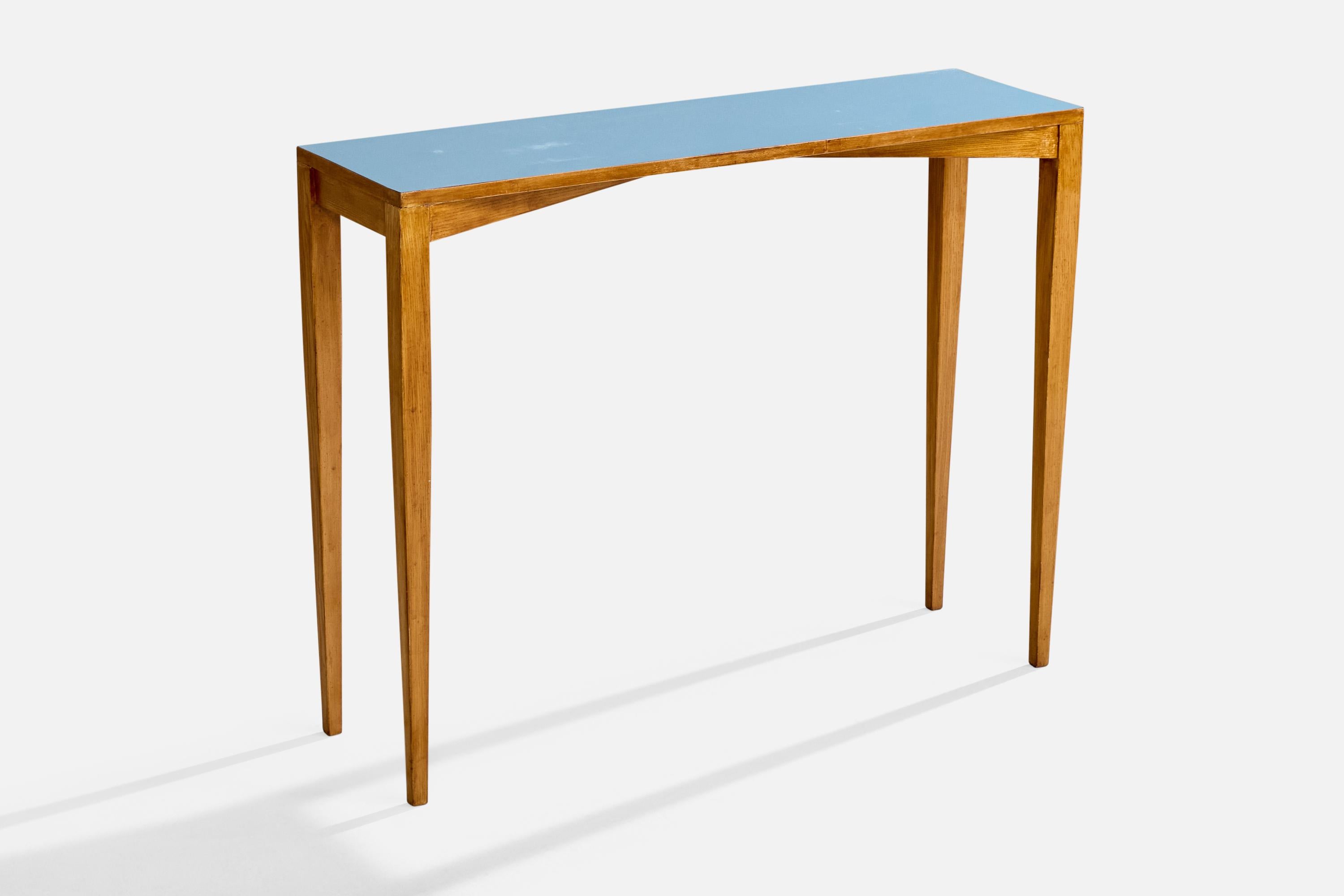 An ash and blue laminate console table designed by Gio Ponti and produced by ISA Bergamo, Italy, 1950s.

Provenance: Hotel Royal, Pietra Ligure.

Authenticated by the Gio Ponti Archives.

Overall Dimensions (inches): 31.0