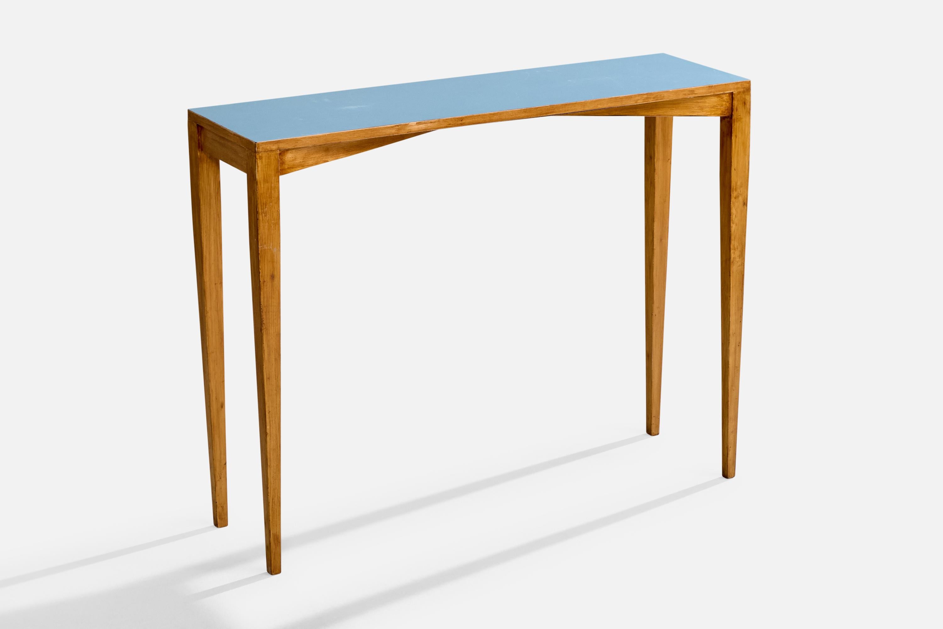 An ash and blue laminate console table designed by Gio Ponti and produced by ISA Bergamo, Italy, 1950s.

Provenance: Hotel Royal, Pietra Ligure.

Authenticated by the Gio Ponti Archives.

Overall Dimensions (inches): 31.0