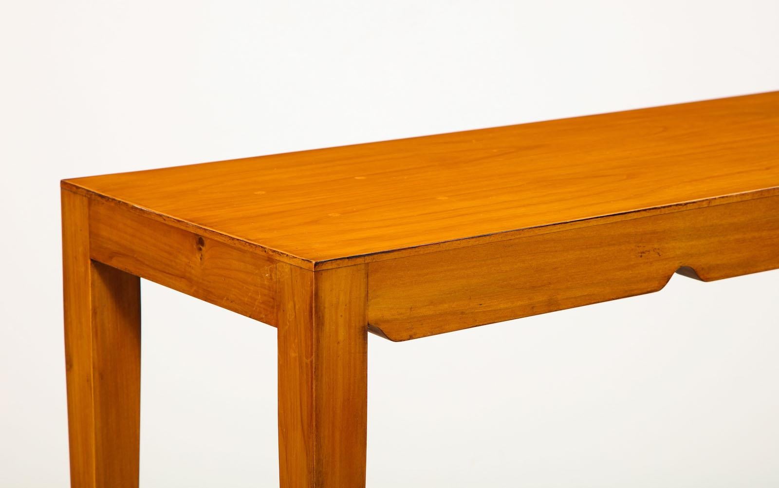 Rare petite console table by Gio Ponti. Rectangular form of cherrywood with scalloped detail around the outside edge. Four tapering legs with brass sabots. Provenance: Private collection - Padova, Italy.