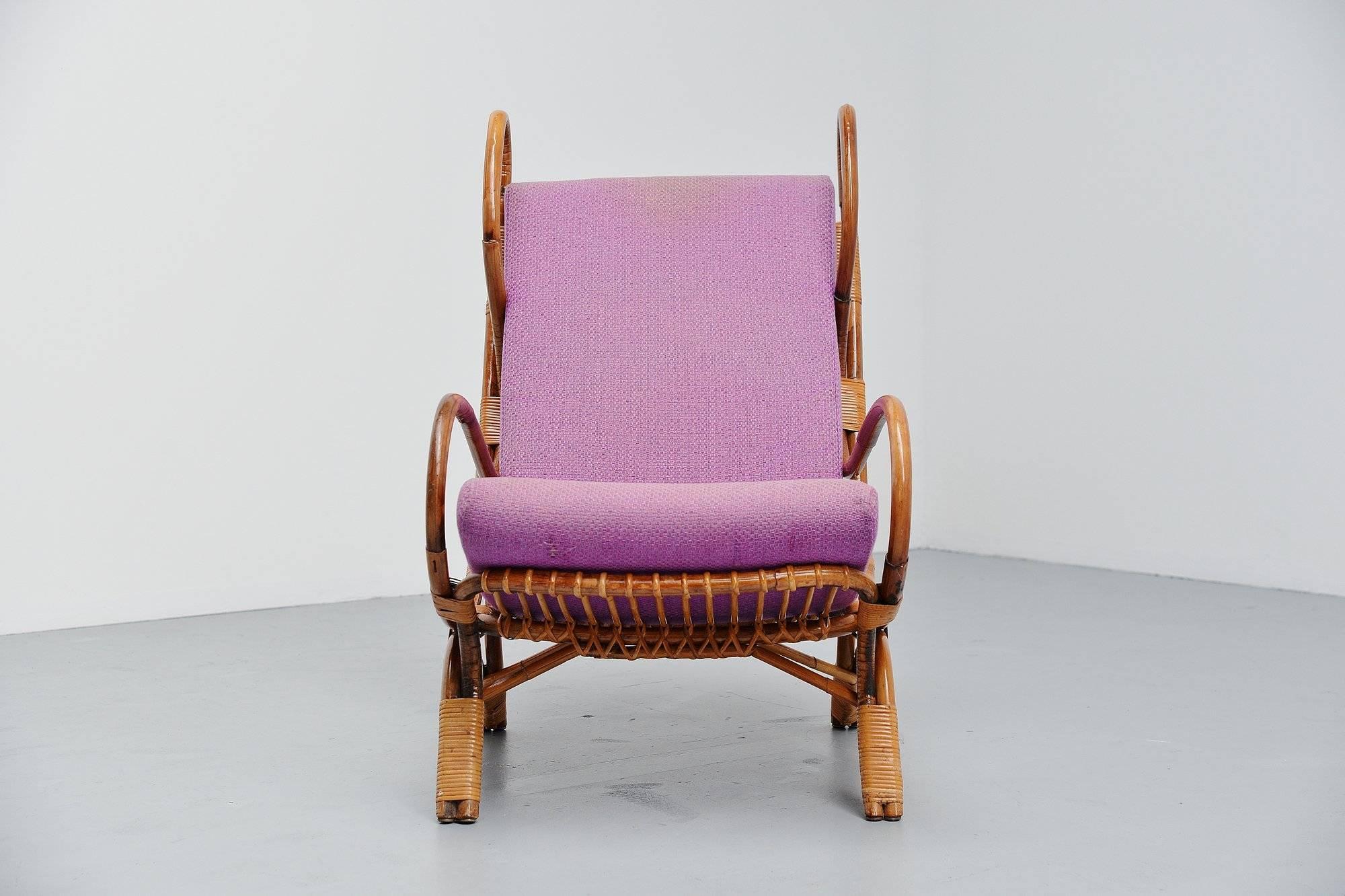 Rare bamboo 'Continuum' lounge chair model BP16 designed by Gio Ponti, manufactured by Bonacina, Lurago d'Erba, Como Italy 1963. The chair is completely made of bamboo and wicker and still has its original purple upholstery and cushion. The cushion