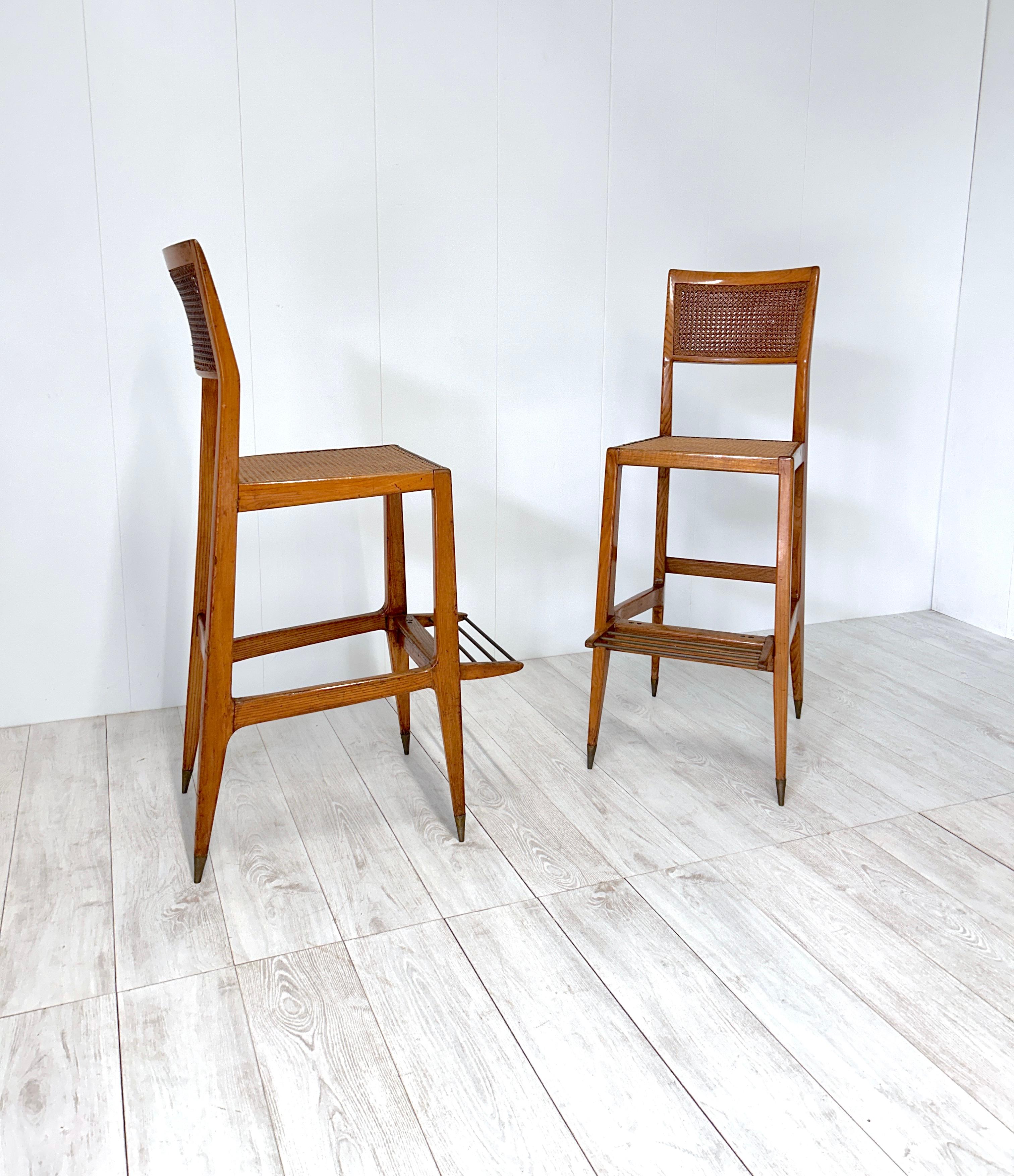 Pair of croupier stools made for Casino di Sanremo (Italy) in the 1950s.
Ash wood frame, brass ferrules, Vienna straw seat and back.

Great vintage condition. 
