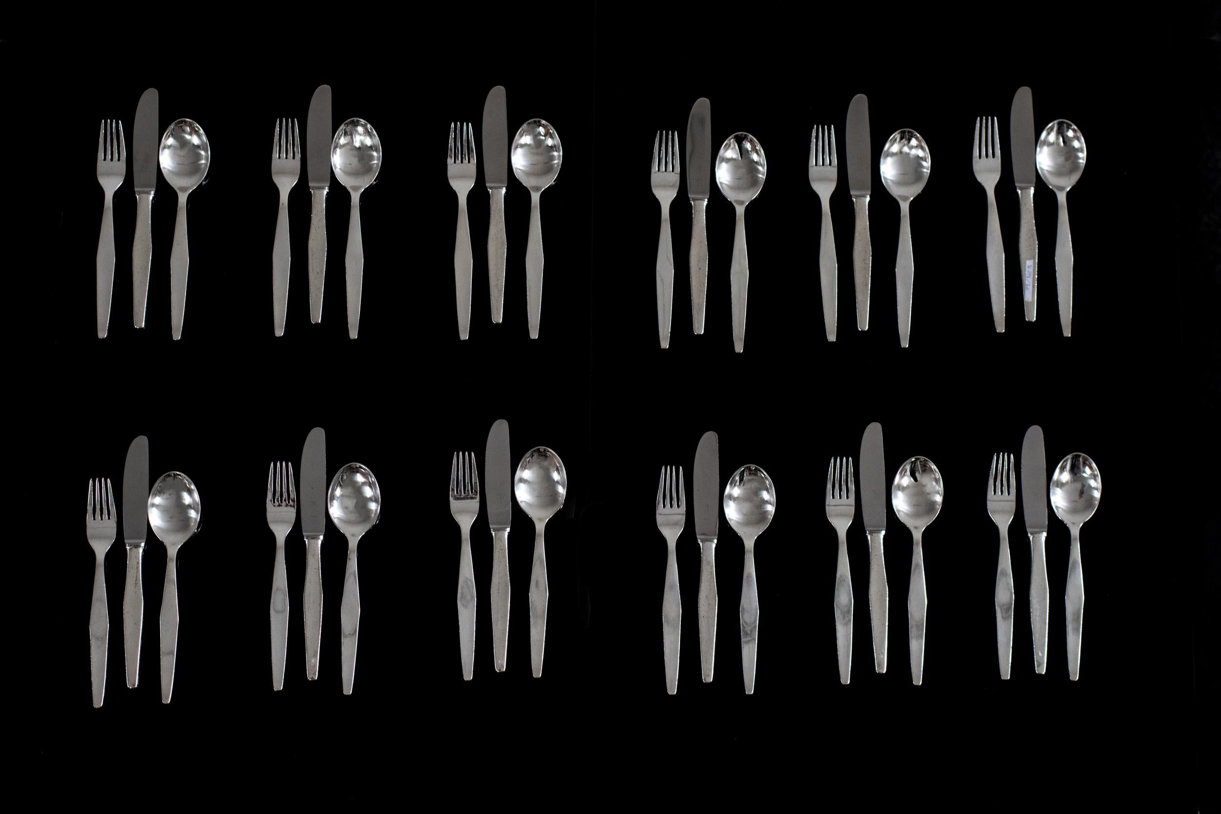 Cutlery silver set for twelve in nickel silver or German silver, this set includes a total of 36 pieces; 12 spoons, 12 forks, and 12 knives with a steel blade. 

Set designed by Gio Ponti for several hotels like the Granada, Solemare, and Murex,