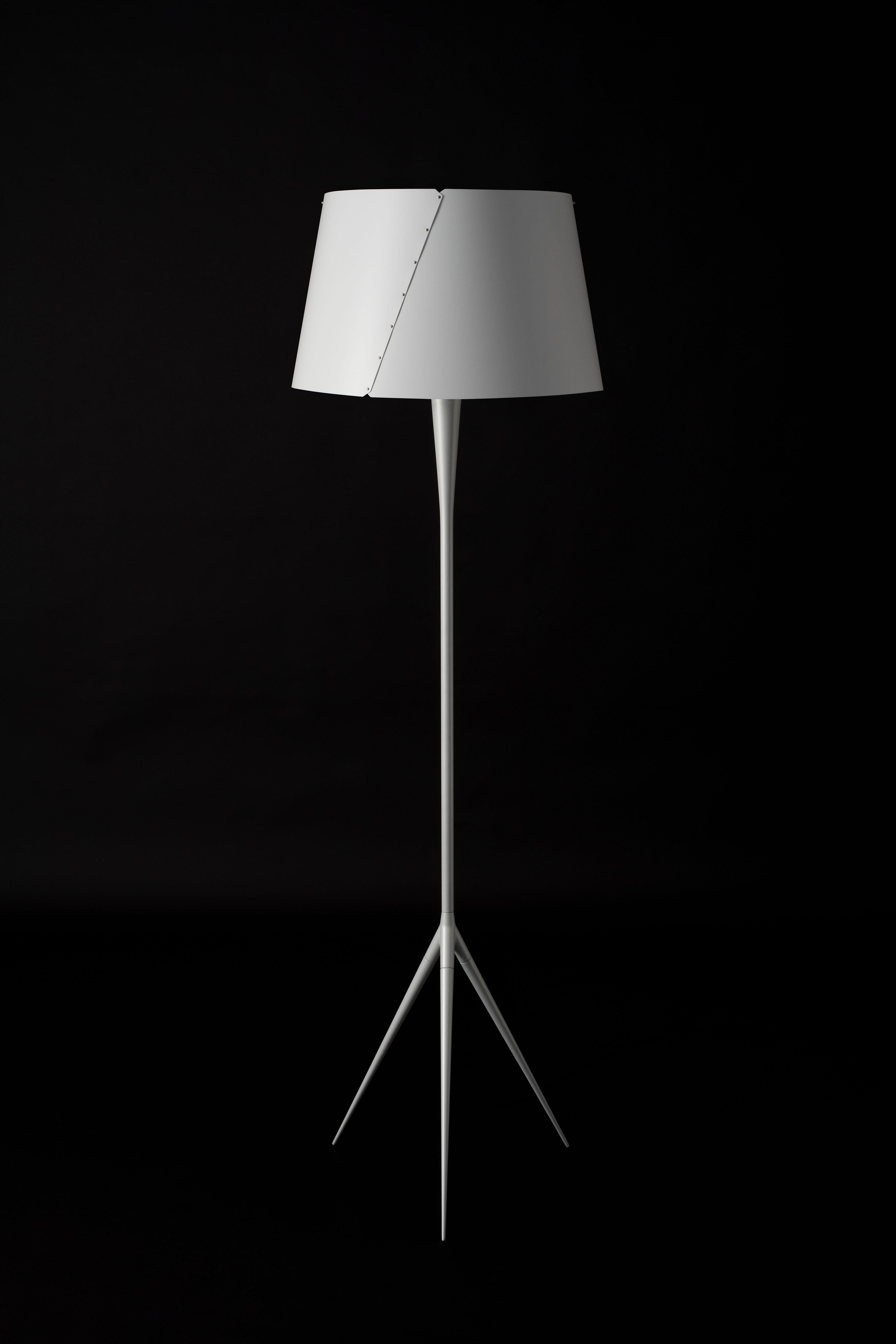 Gio Ponti De-Lux B4 floor lamp in silver for Tato Italia. 

Originally designed by Italian icon Gio Ponti in 1955, this authorized re-edition by Tato Italia is executed in aluminum and iron with a white polypropylene shade.

Price is per item.