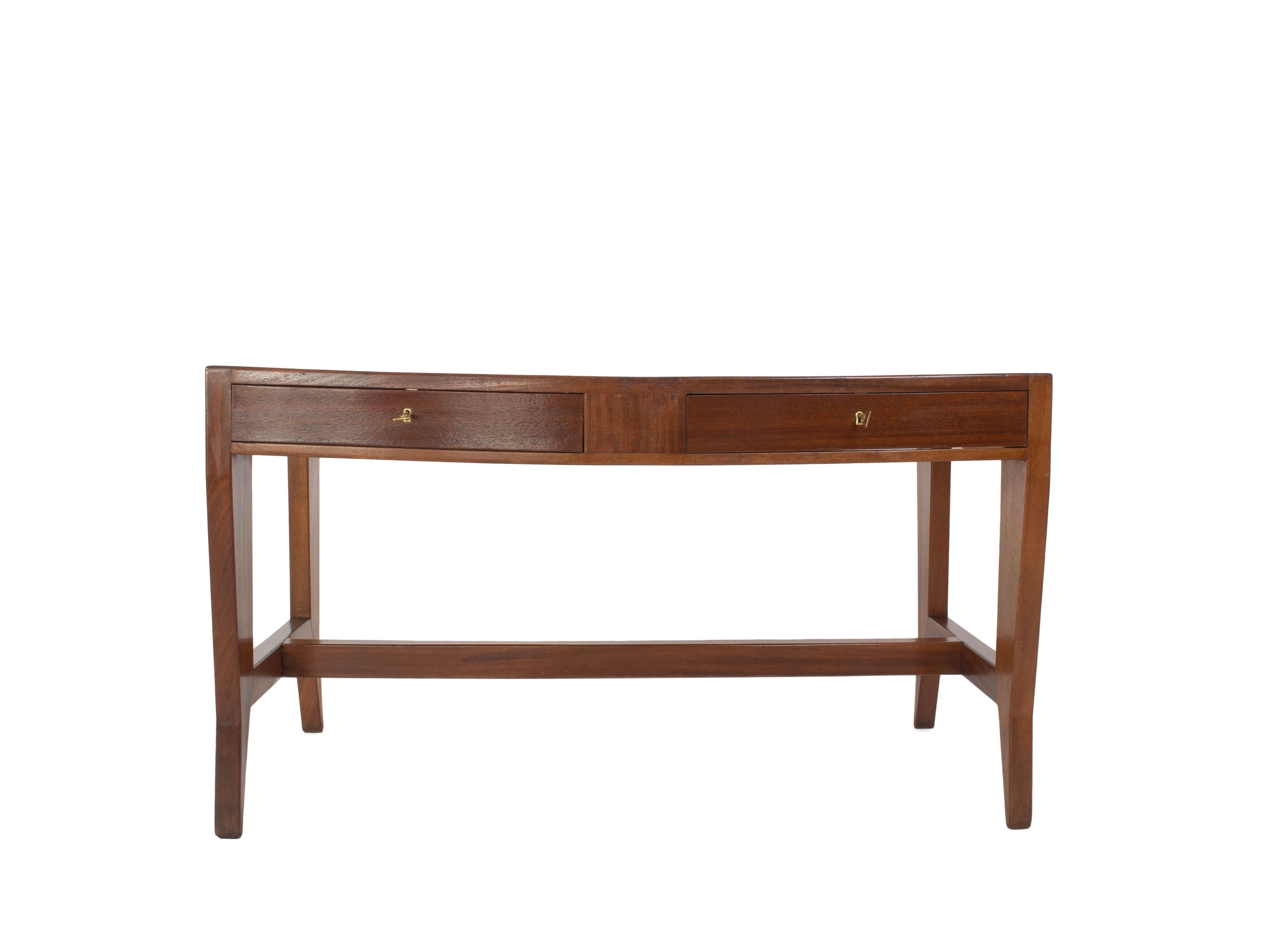 Gio Ponti Desk in Mahogany Veneer and Beech Wood produced by Schirolli for the 'Banca Nazionale del Lavoro', Italy 1950s. This desk has two drawers with beautiful brass keyholes and keys. It has distinctive features from Gio Ponti with the cut