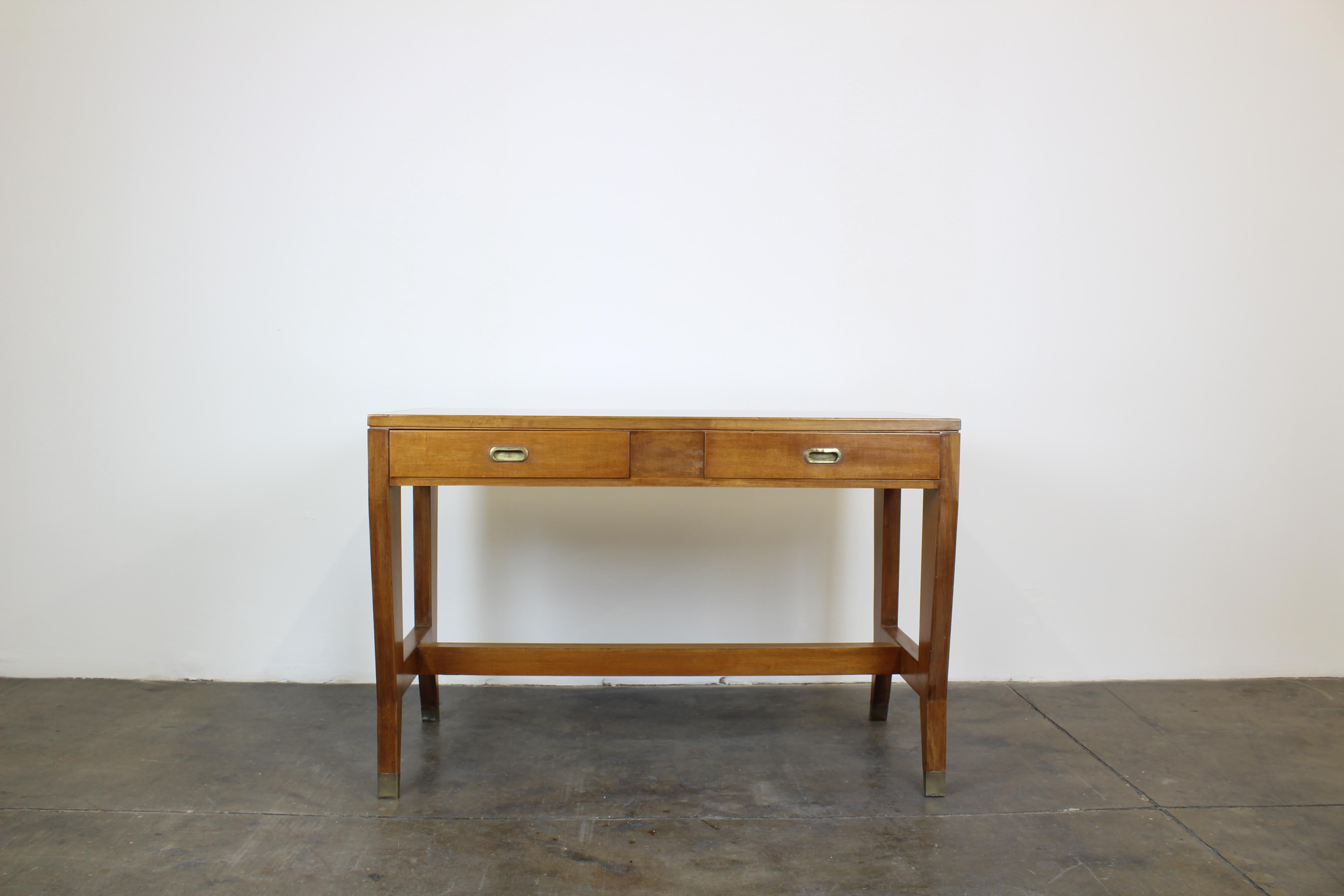 Desk with two frontal drawers by Gio Ponti.
Walnut wood, formica top, brass details (handles and feet).
Designed for the offices of BNL (Banca Nazionale del Lavoro) and manufactured by the Italian Company Schirolli in the mid-1950s.

Measures: