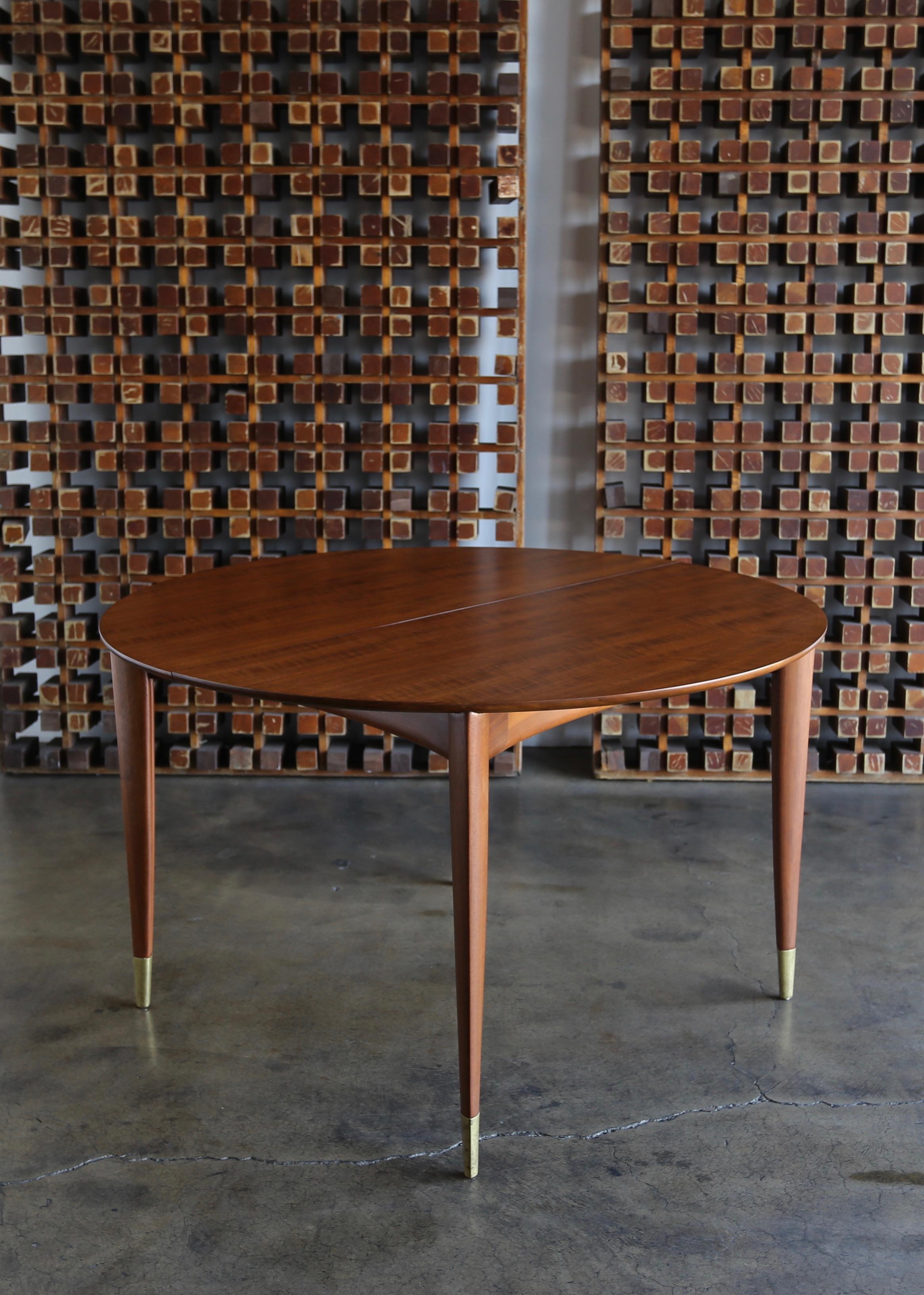 Gio Ponti dining table for M. Singer & Sons, circa 1955. This piece has been professionally restored. Includes four leaves. 

This piece expands up to 103.88 wide.