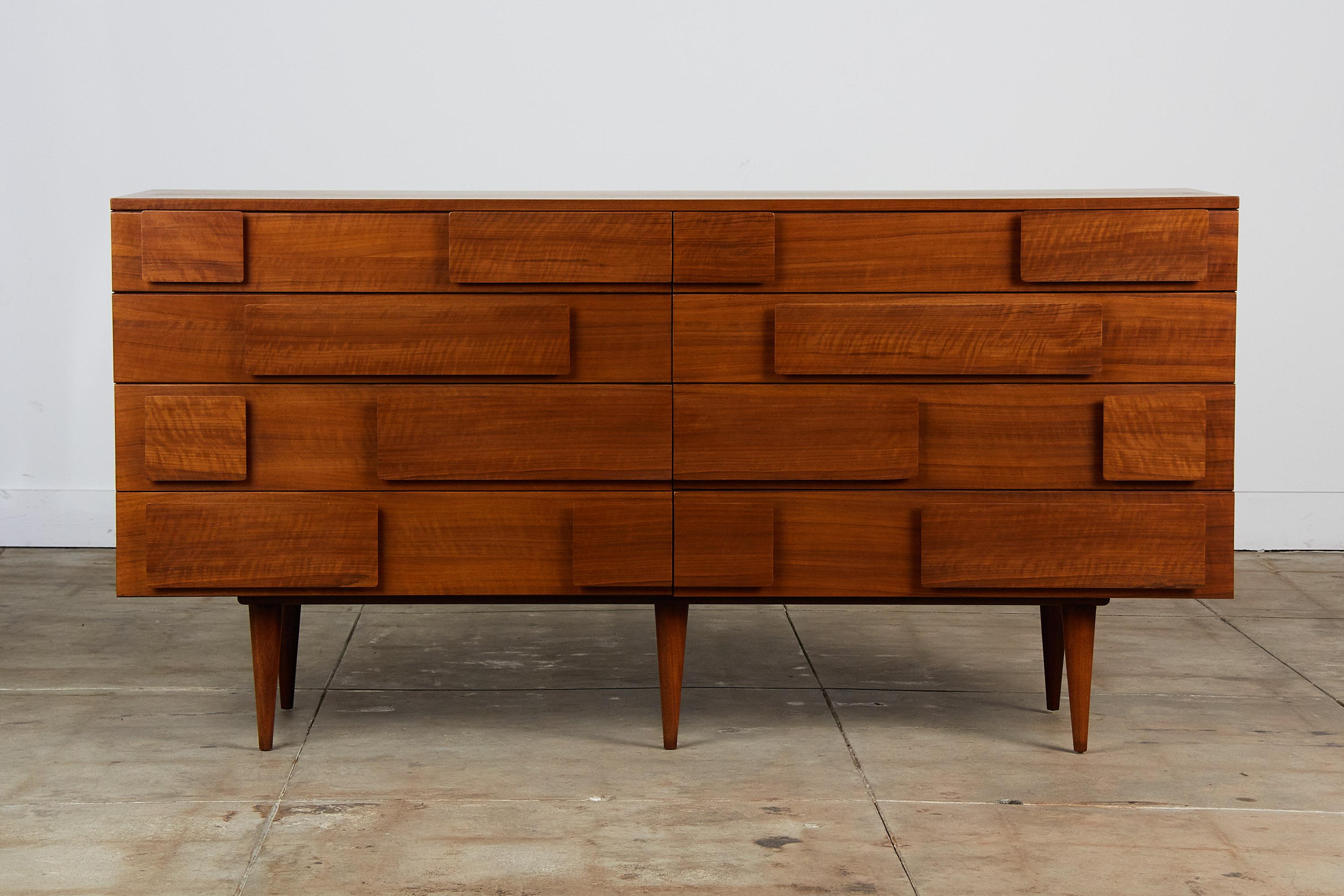 This stunning walnut dresser by Gio Ponti for Singer & Sons, c.1950s, Italy is an exquisite example of mid-century craftsmanship. This piece features modernist geometric walnut drawer pulls and tapered legs. The upper drawer houses a small multi