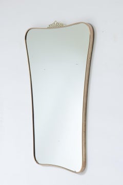 Gio ponti Elegant mirror with shaped brass frame