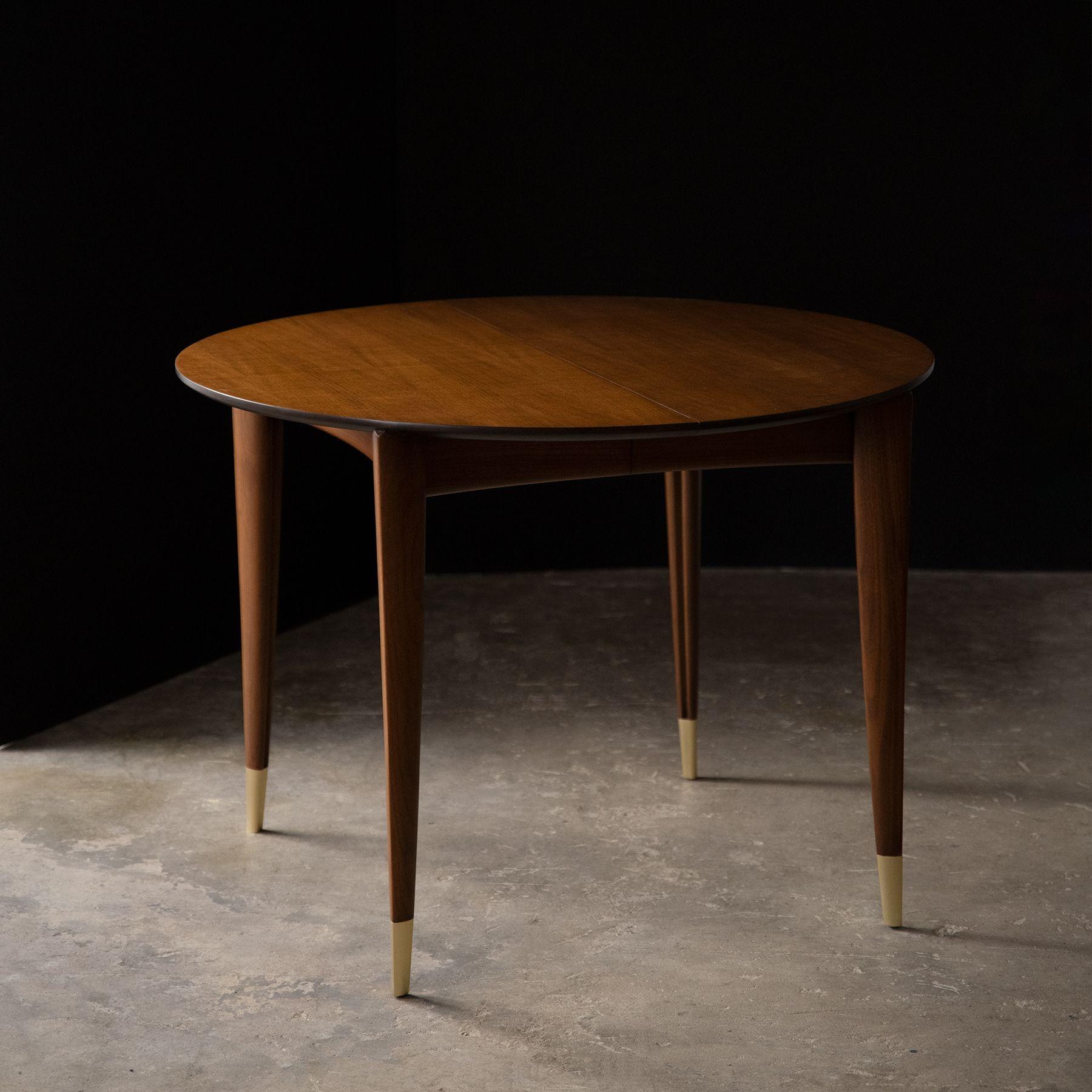 Extraordinarily well-crafted Italian Walnut Dining Table designed by Gio Ponti and Produced in Italian Walnut by M. Singer & Sons circa 1950. This example has been very well preserved and was professionally refinished to the highest possible