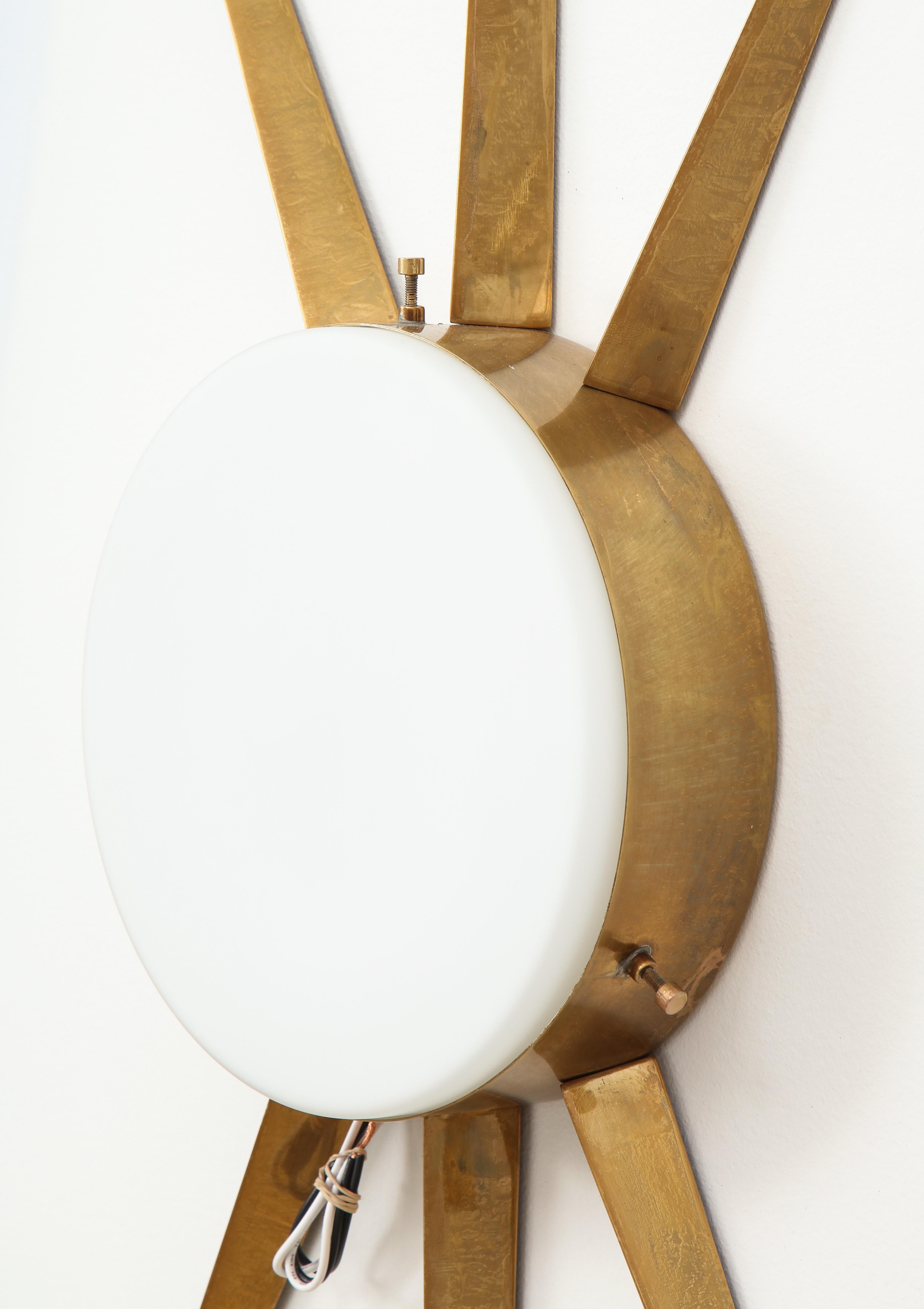 Gio Ponti for Arredoluce rare large pair of sconces or ceiling lights with radiating brass structures and frosted glass shades. 
This model was recently confirmed to have been a Gio Ponti design through Gio Ponti archives by Wright auction house