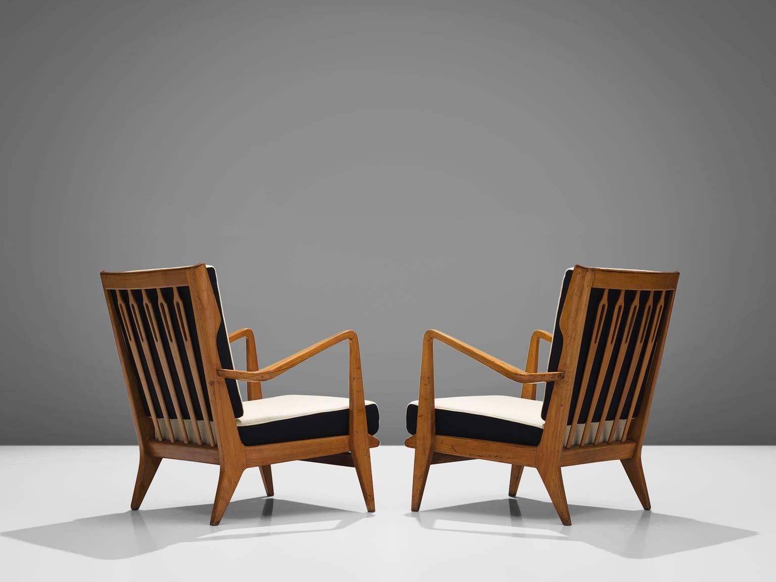 Gio Ponti for Cassina, pair of armchairs model 516, walnut, black and white balder fabric, Cassina, Italy, 1955.

This set of chairs is designed by Gio Ponti and manufactured by Cassina. The chairs have a few distinct features that stand out. For
