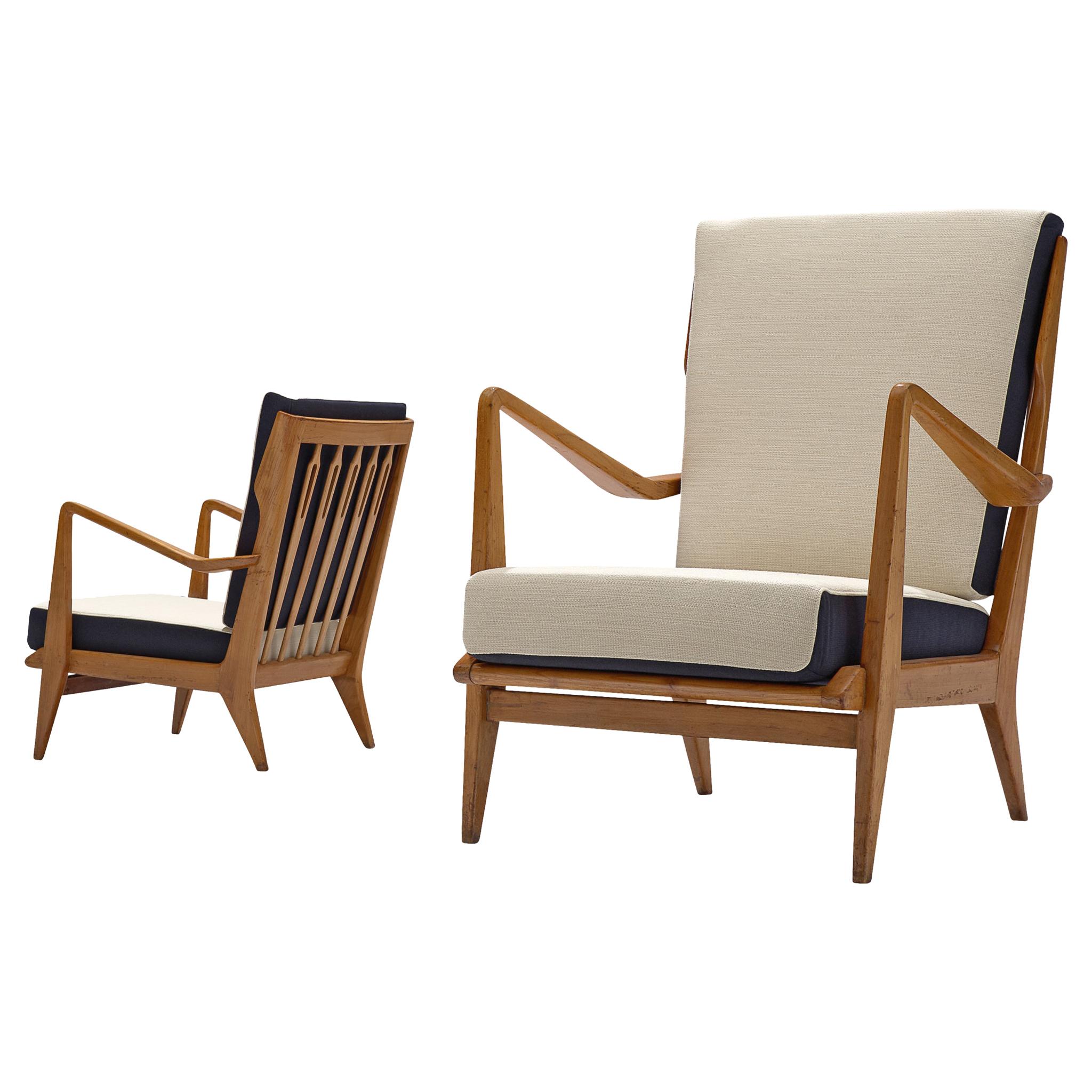 Gio Ponti for Cassina, pair of armchairs model 516, walnut, black and white balder fabric, Cassina, Italy, 1955.

This set of chairs is designed by Gio Ponti and manufactured by Cassina. The chairs have a few distinct features that stand out. For