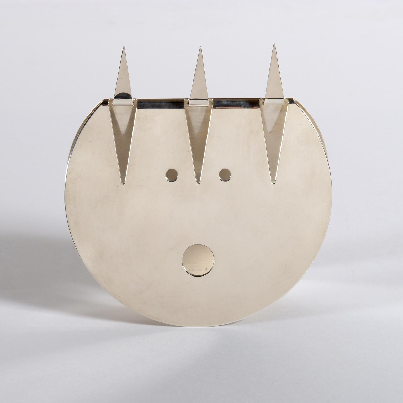 Gio Ponti Diavoletto little devil mask designed in the 1970s for Christofle and executed by Lino Sabattini in pierced steel.
This iconic and ironic image of Imp is typical of the architect Gio Ponti's artistic research for the objects he has been