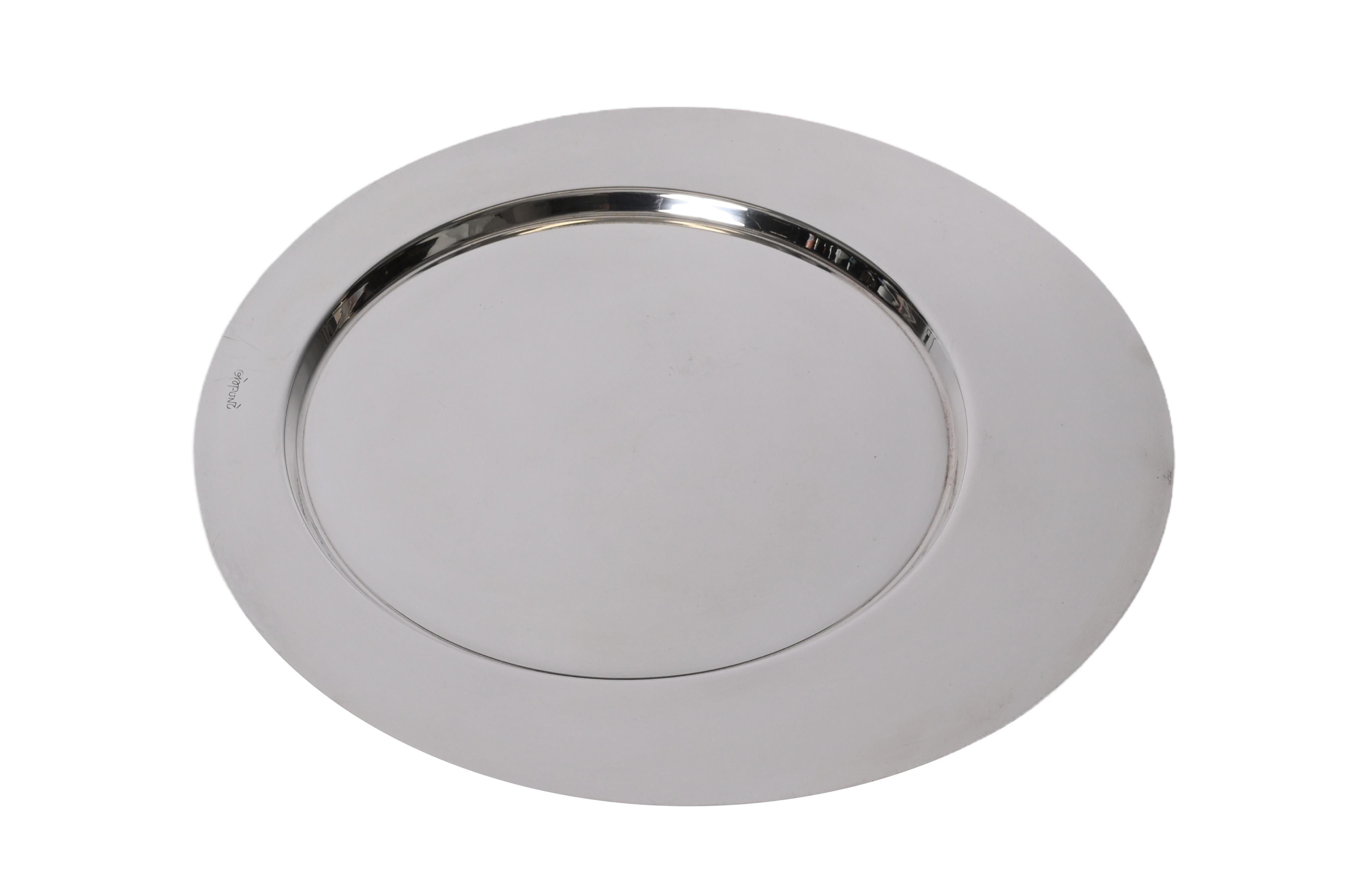 Amazing mid-century silver plate serving plate. Gio Ponti designed and signed this astonishing item for Cleto Munari in Italy during the 1980s.

The flat and efficient design on two round levels, make this piece simply irresistible and iconic for