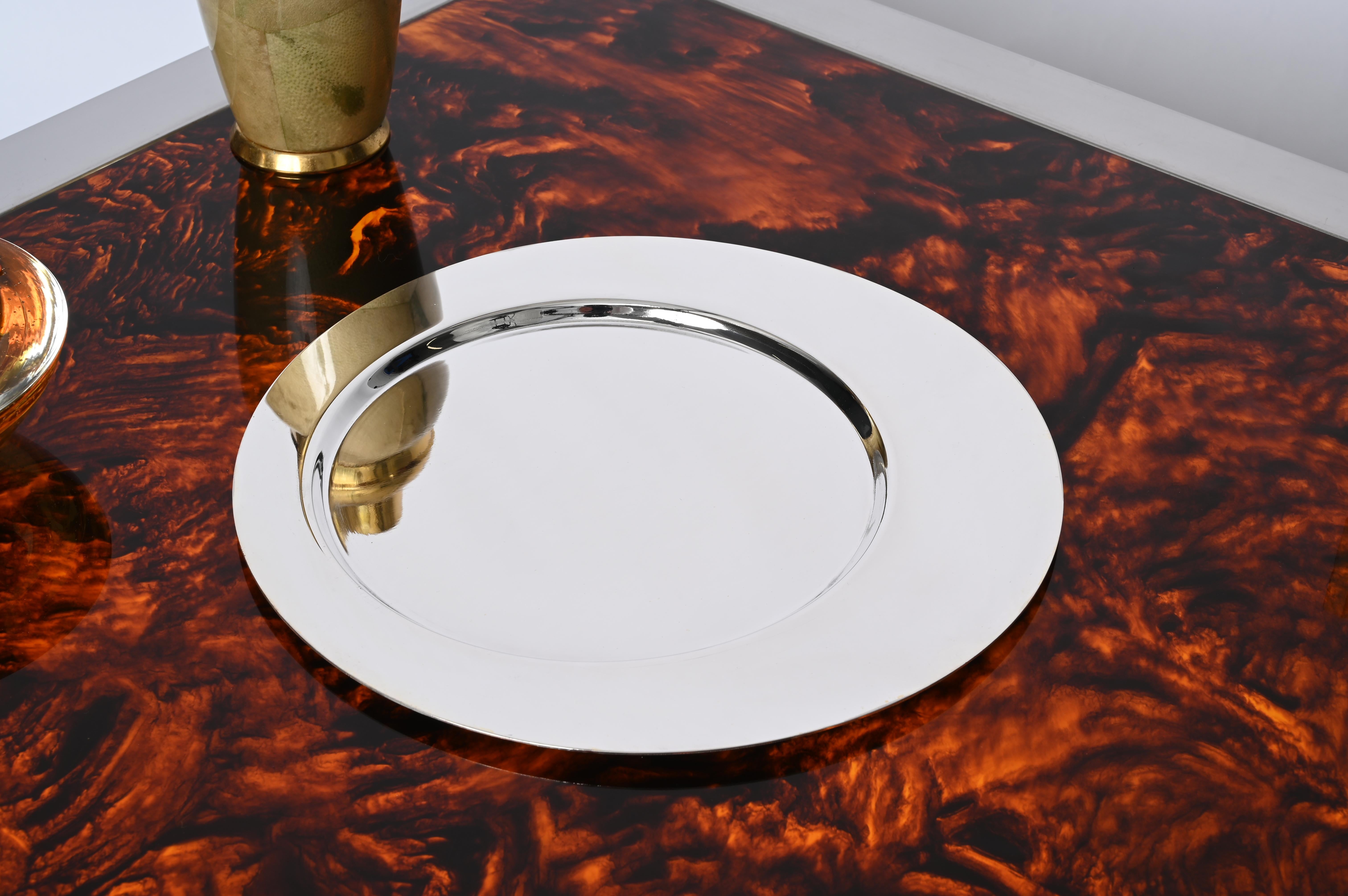 Wonderful Mid-Century silver plated serving plate or vide poche designed and signed by Gio Ponti for Cleto Munari, in Italy during the 1980s. 

The flat and efficient design on two round decentered levels, make this piece simply irresistible and