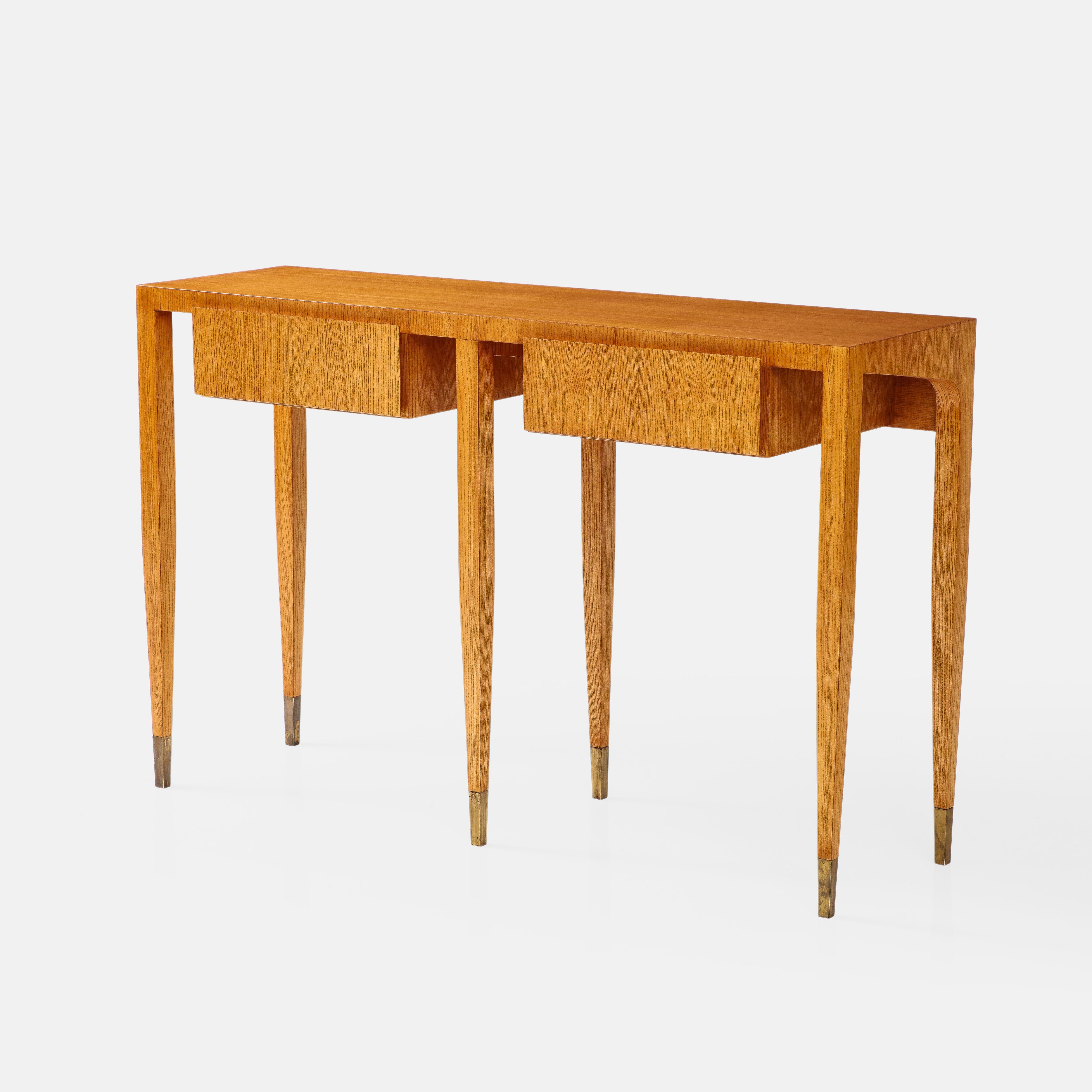 Gio Ponti for Giordano Chiesa rare and important ash wood console table with two drawers and six legs ending in brass sabots, Italy, circa 1955. This exquisite sculptural console has fine details throughout and clean architectural lines with cutout