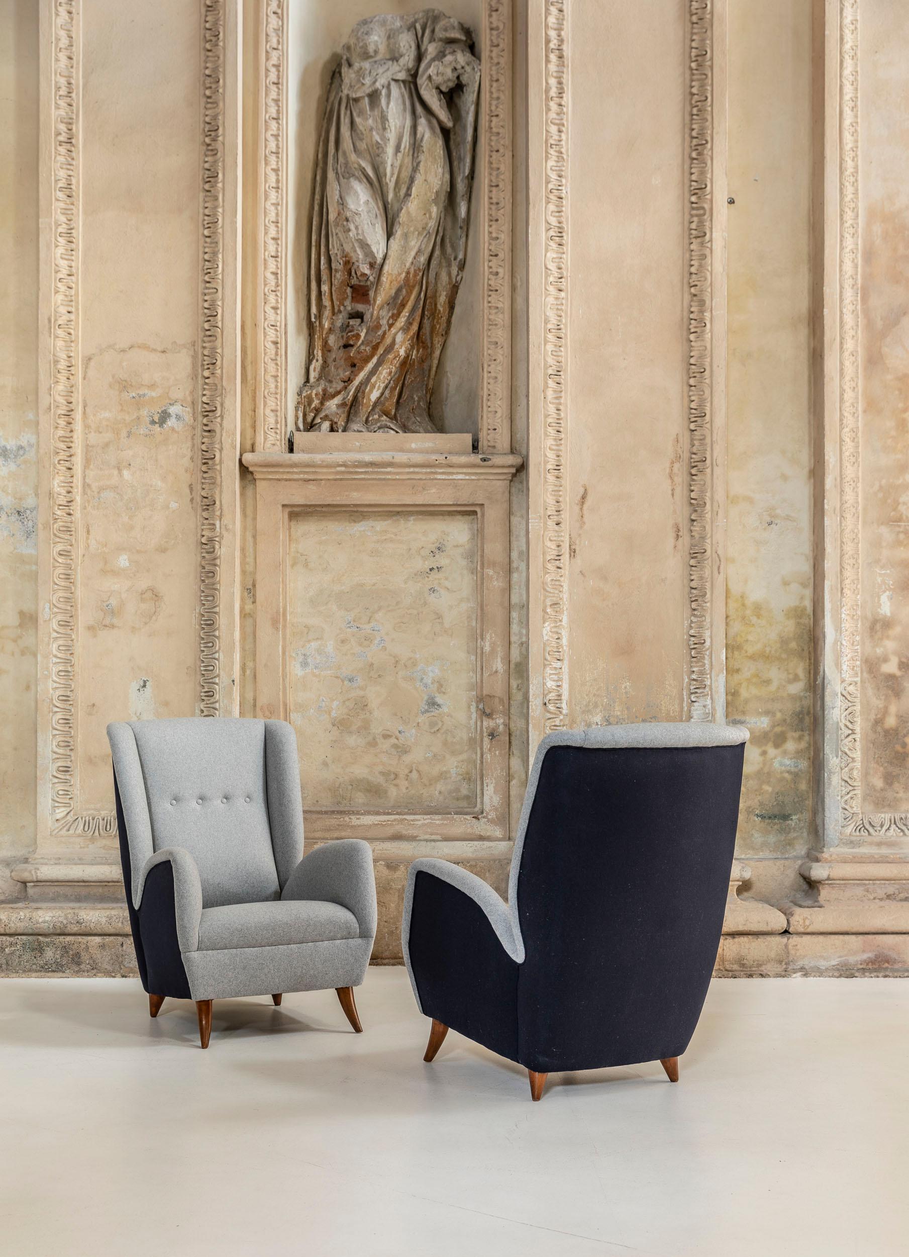 Grey and blue wool reupholstered armchairs attributed to Gio Ponti for ISA.
Original walnut wood legs, elegant shaped and comfortable chairs.