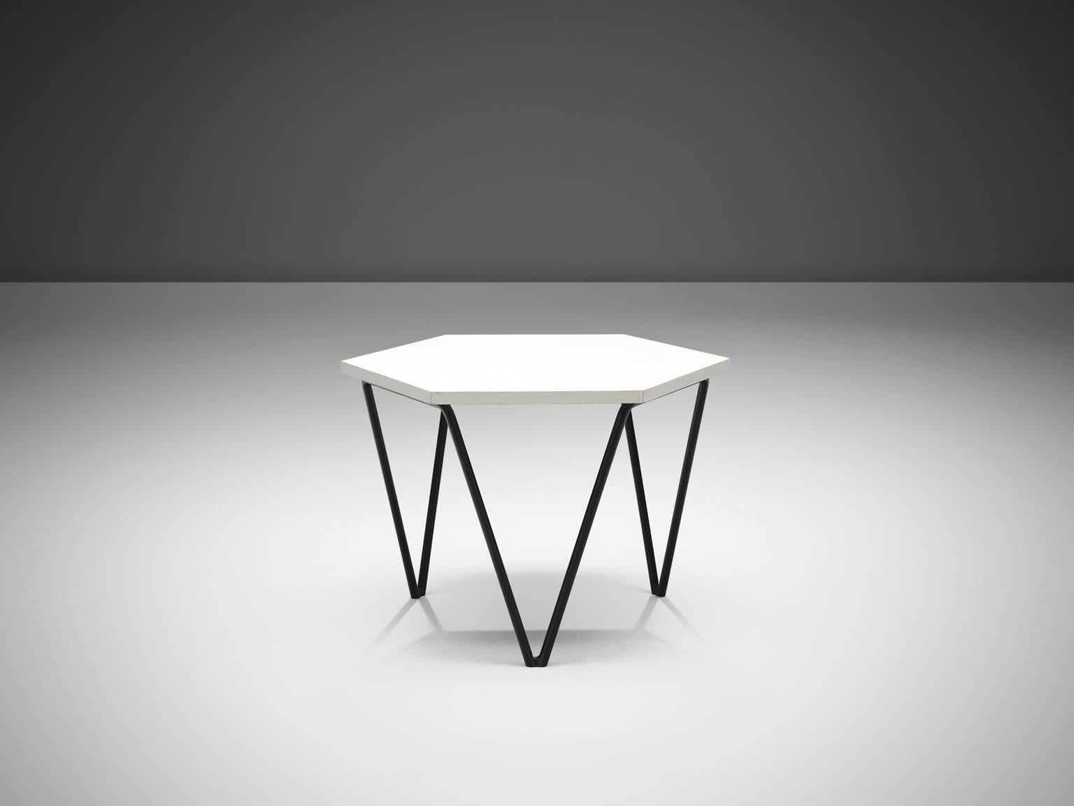 Gio Ponti for ISA, side table in white, black metal frame, Italy, 1950s.

This side table designed by Gio Ponti has a honeycomb shape and three triangular legs. The metal base has their original patina, tabletop is made out of white coated wood.