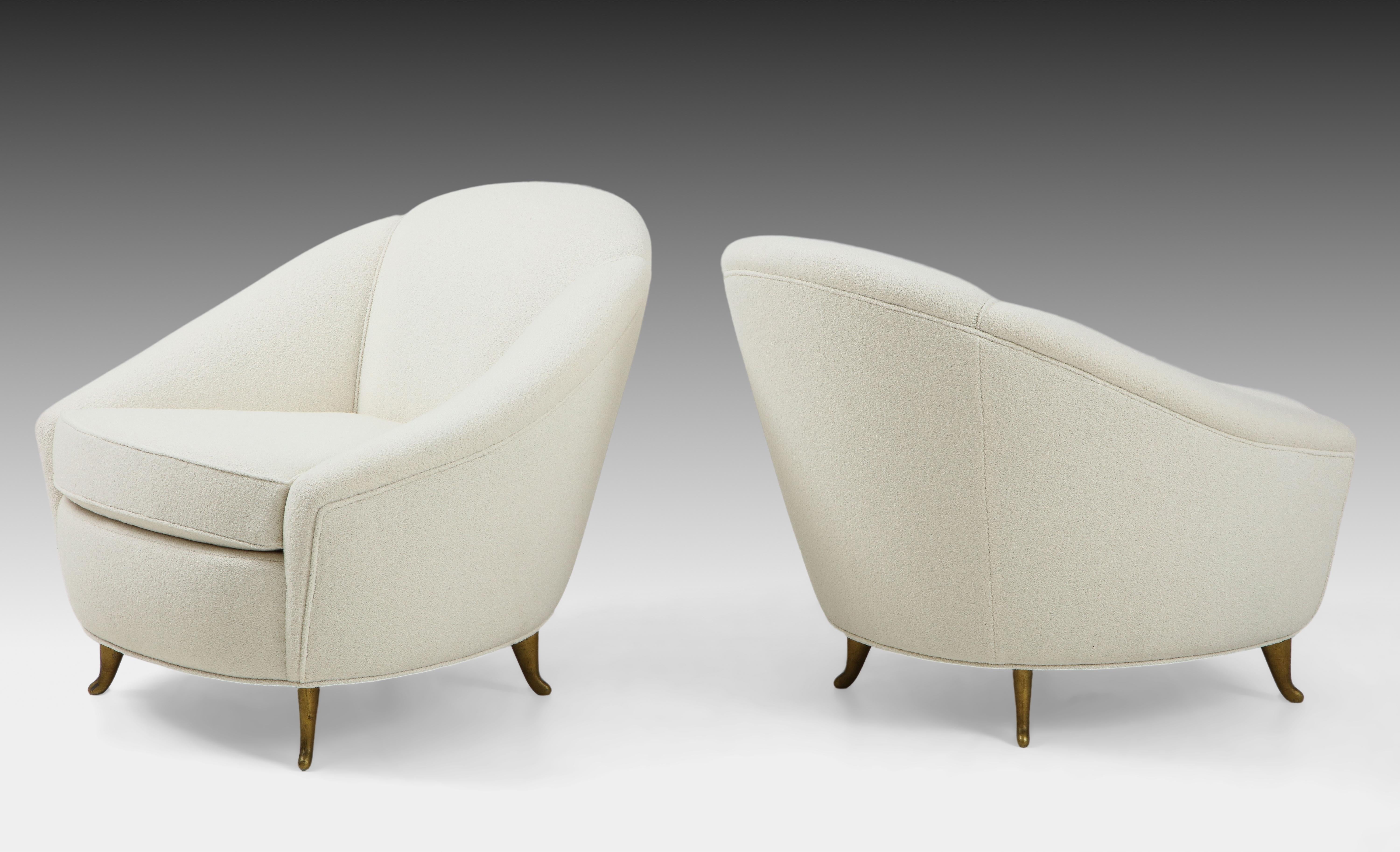 Designed by Gio Ponti in 1936 and manufactured by ISA Bergamo in the 1950s, pair of upholstered armchairs or lounge chairs with elegantly curved back and signature brass legs. These classic and exquisite armchairs have been fully restored and newly
