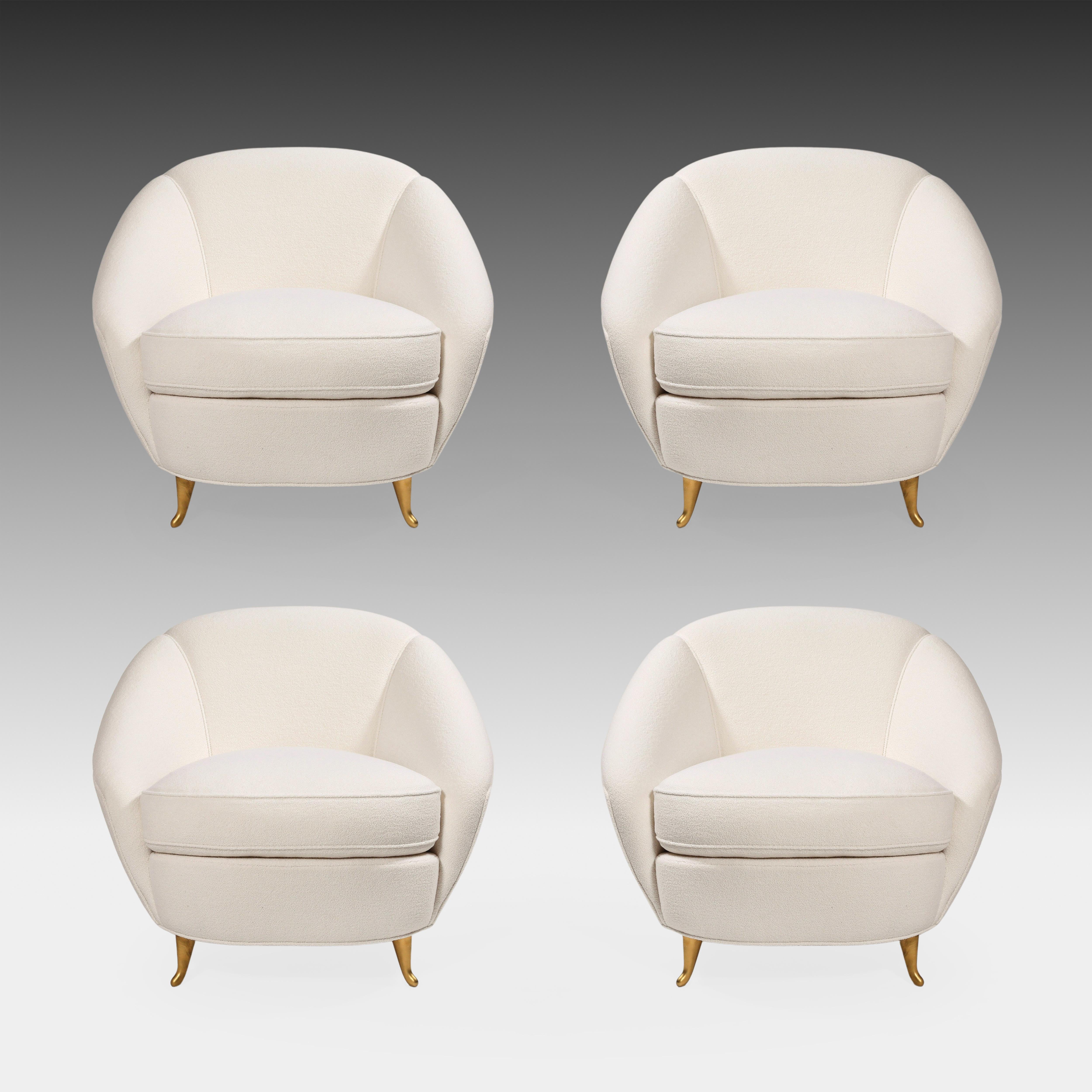 Designed by Gio Ponti in 1936 and manufactured by ISA Bergamo in the 1950s, rare set of four exquisite upholstered armchairs or lounge chairs with curved back and gilt metal legs. This elegant model lounge chair has beautiful soft curves throughout