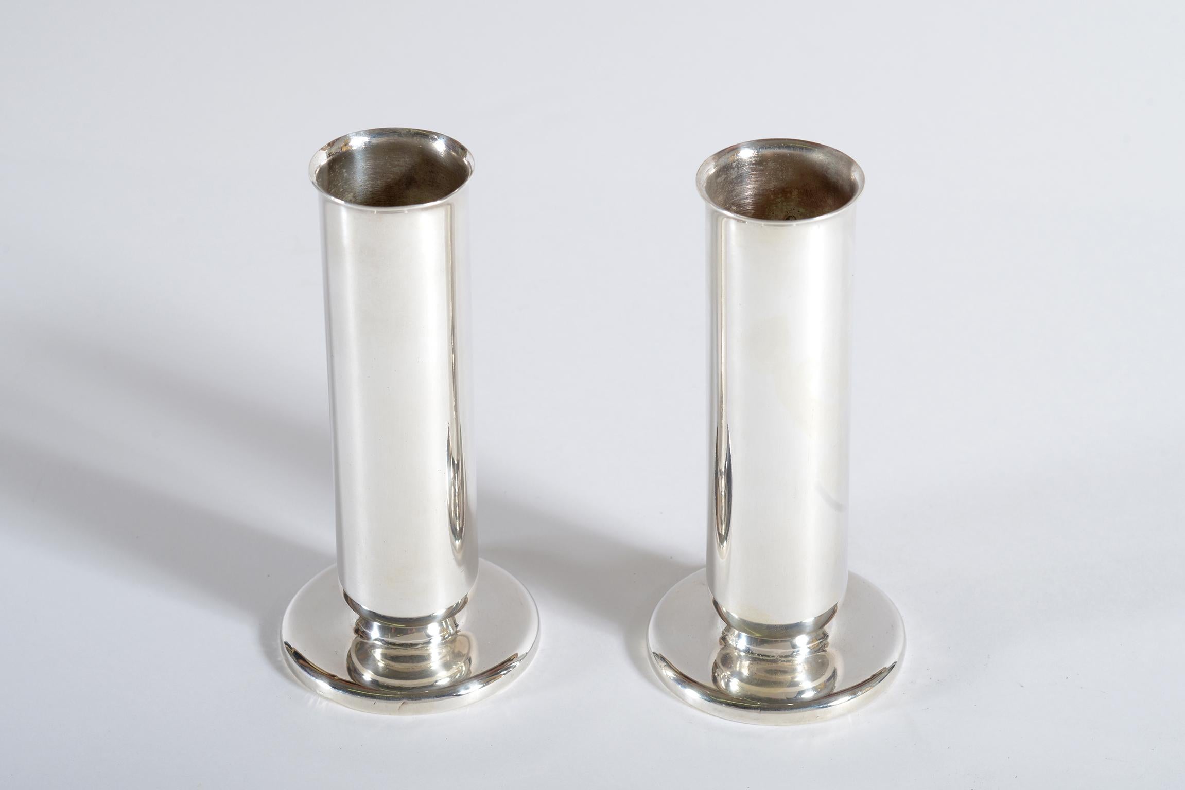 Gio Ponti pair of vases or candlesticks designed in the 1930s and executed by Krupp Milano in silvered Alpacca.
The simple and elegant cylindrical shape exemplifies the research that Gio Ponti undertook in his work for Arthur Krupp starting from