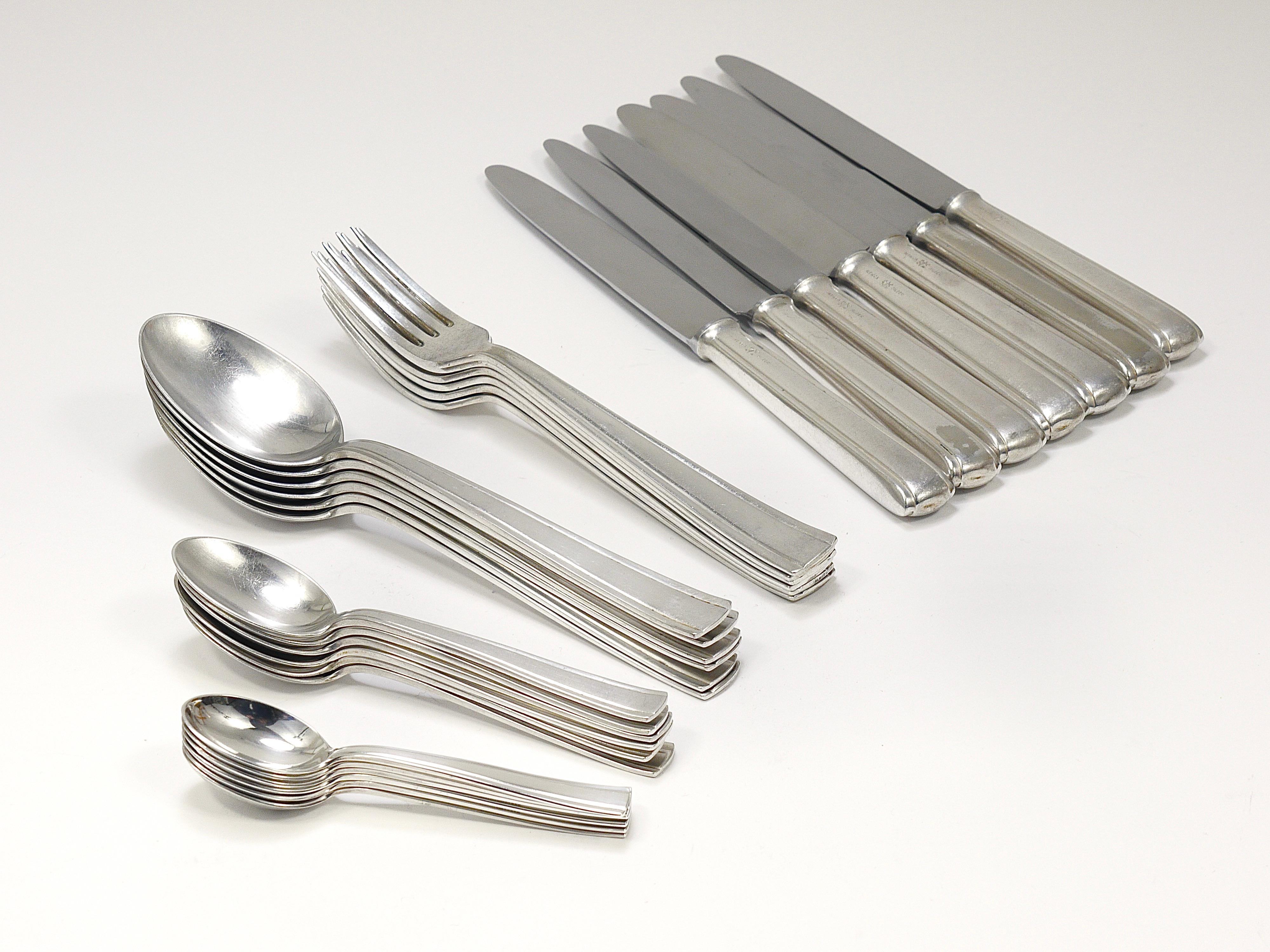 Elegant Art Deco flatware, designed by Gio Ponti for Arthur Krupp and crafted in the 1950s by Krupp Berndorf in Austria. This exquisite cutlery is made from nickel-silvered Alpacca metal, characterized by its strict and geometric lines that
