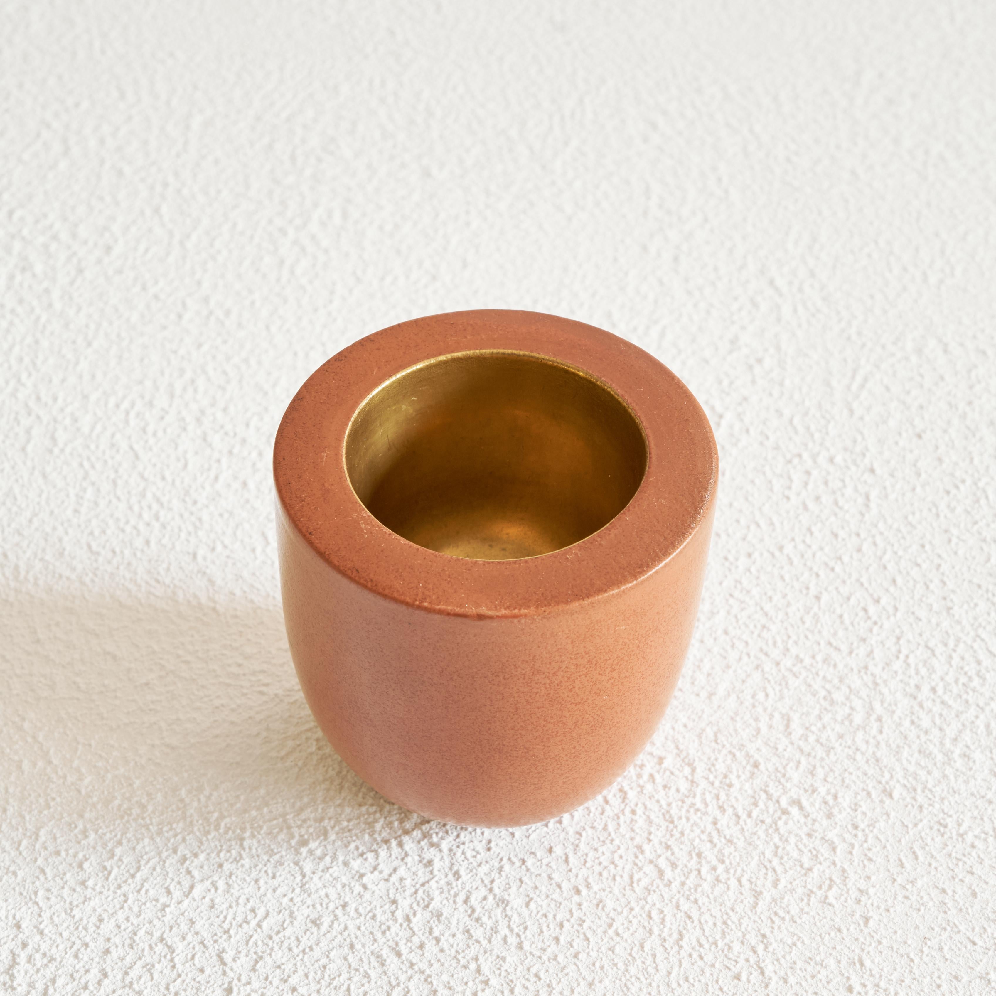 Gio Ponti for Richard Ginori vase in terracotta and gold, Italy, 1930s.

It is a wonderful little gem, this vase designed by Gio Ponti and made by Richard Ginori in the 1930s. Great simple design and beautiful contrast between the terracotta and