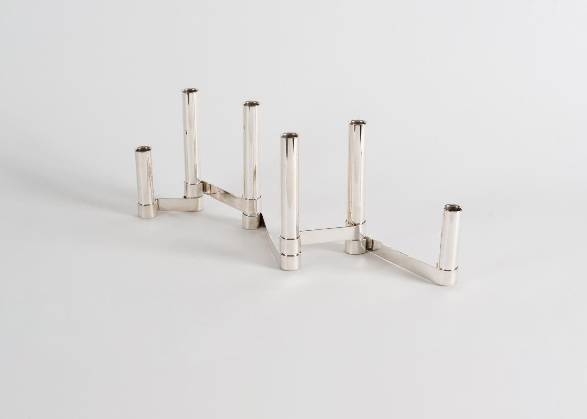 Antibes, composed of six tubes attached to an accordion brace, was possibly produced for use as a chandelier or table centerpiece. 

Inscribed: Sabattini Italy design Gio Ponti 1956.