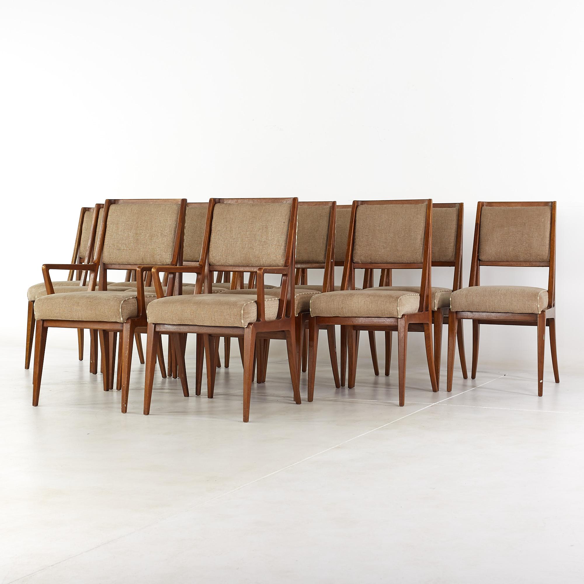 Gio Ponti for Singer and Sons mid-century dining chairs - set of 12.

Each armless chair measures: 19 wide x 23 deep x 37.5 high, with a seat height of 20 inches.
Each captains chair measures: 21.25 wide x 24 deep x 37.5 high, with a seat height