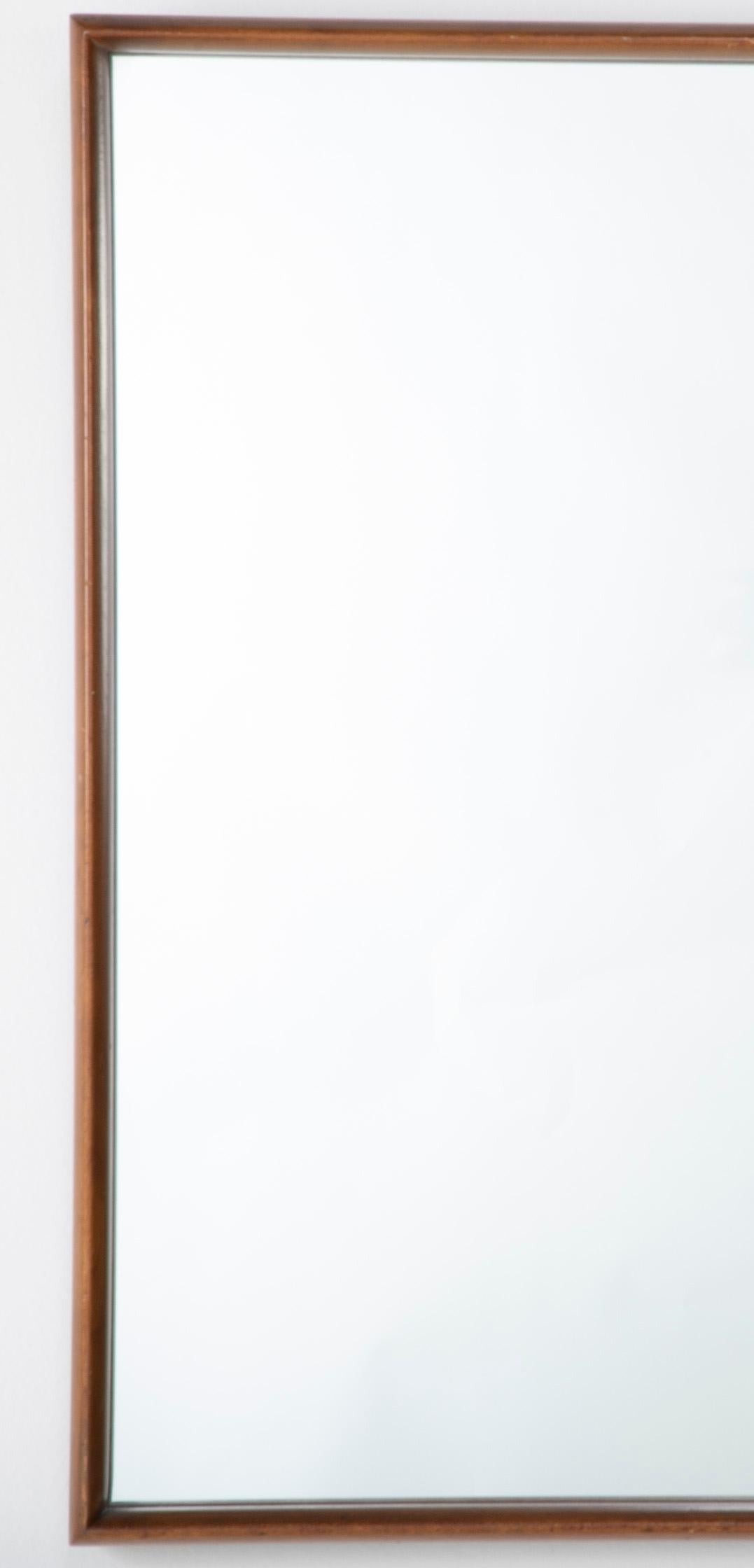Designed by Gio Ponti for Singer Bros. in the early 1950s, this walnut mirror comes from the celebrated “Modern by Singer” line. The collection introduced Ponti’s modernist style to the American market, combining clean, elegant lines with