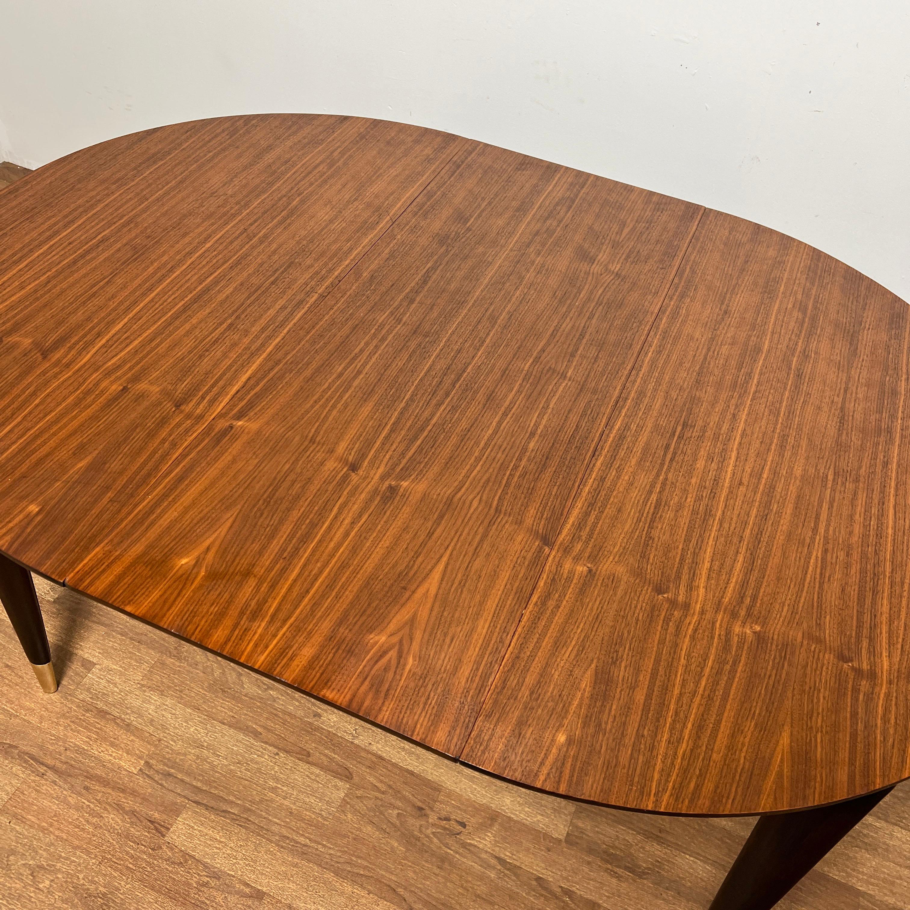 Gio Ponti for Singer Dining Table in Walnut With Brass Sabots Circa 1950s In Good Condition For Sale In Peabody, MA