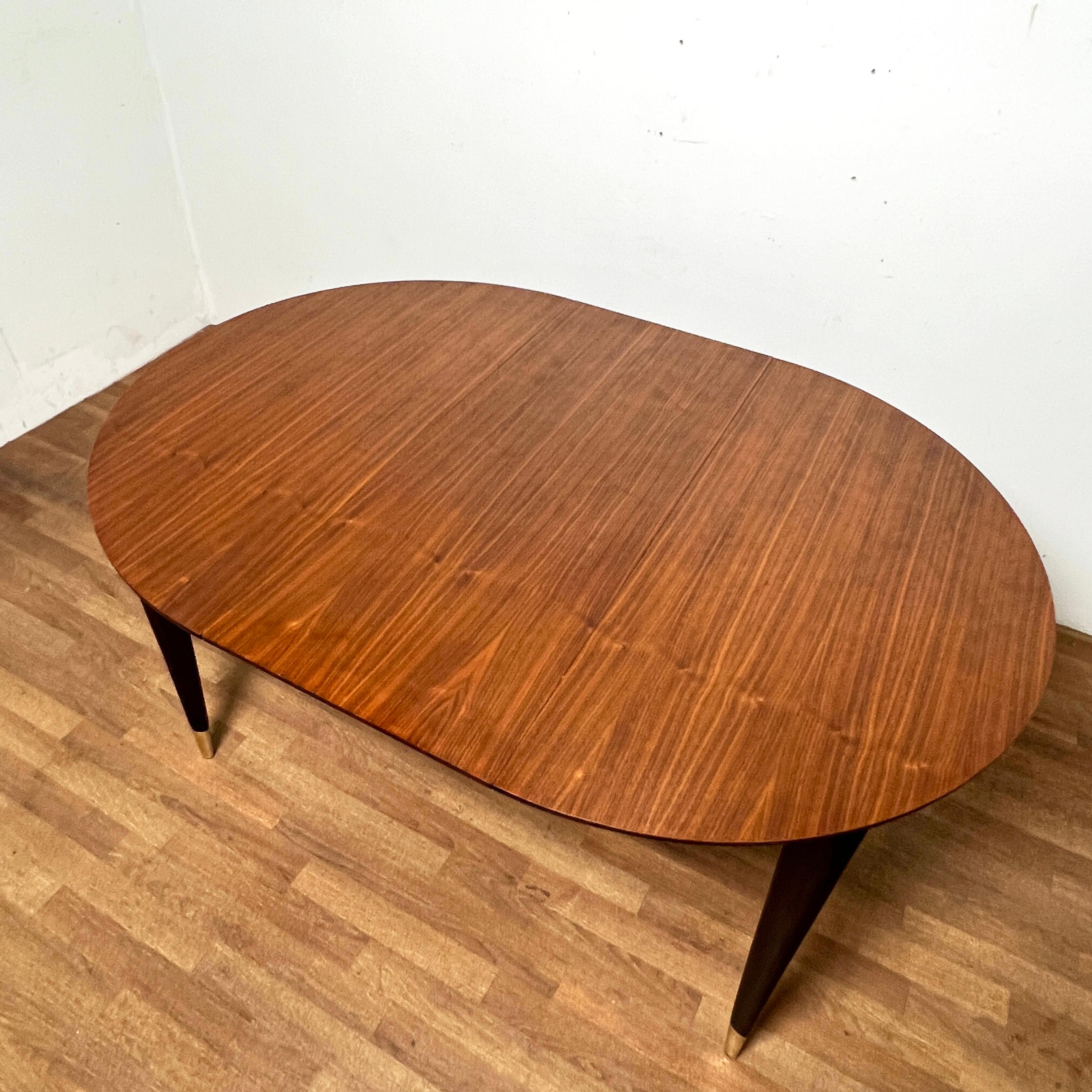 Mid-20th Century Gio Ponti for Singer Dining Table in Walnut With Brass Sabots Circa 1950s For Sale