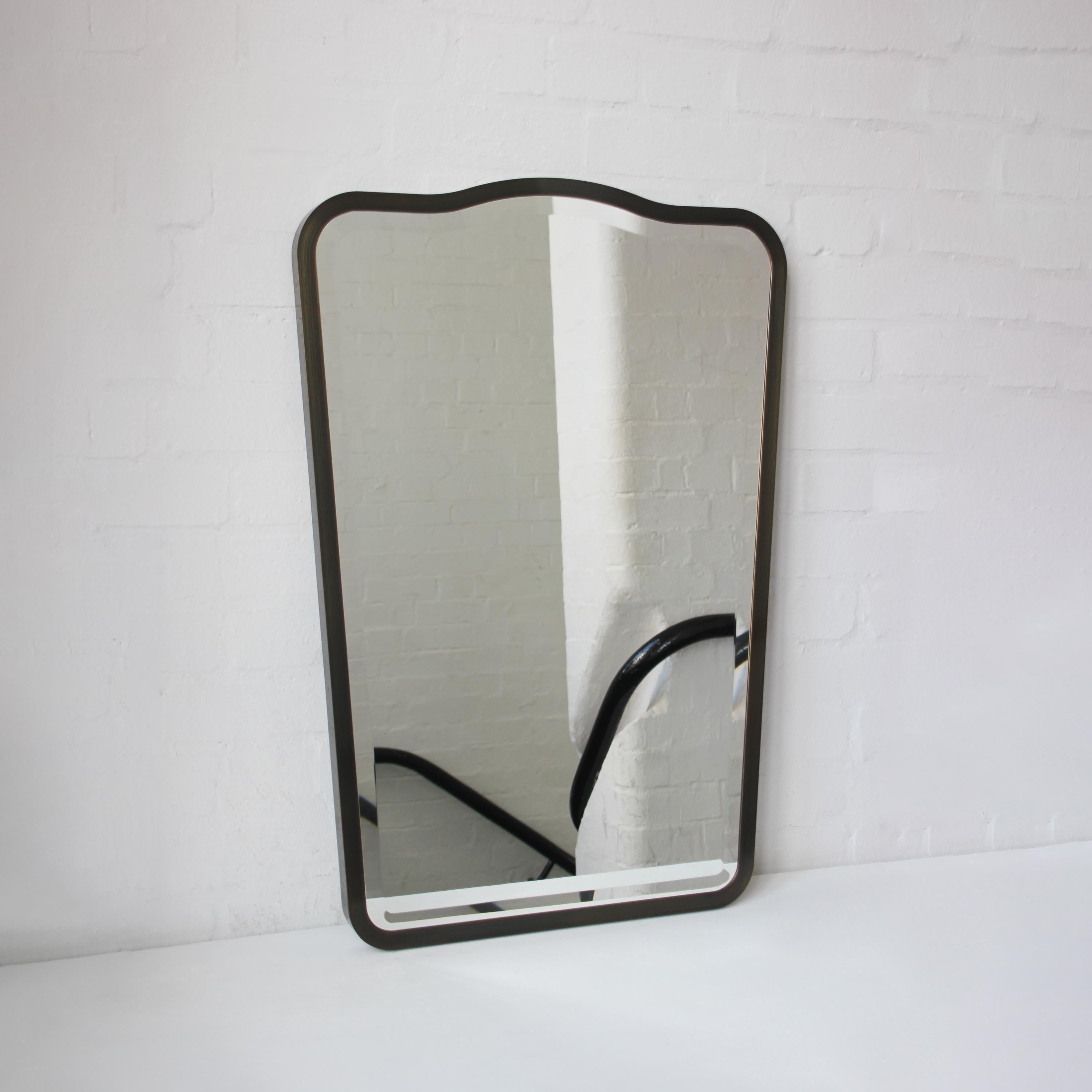 Art deco style mirror with a bevel and a bronze patina full frame inspired by the celebrated work of Italian designer Gio Ponti. Handcrafted in London, UK using pure solid brass.

Mirror dimensions: 1067mm (42“) High x 660mm (26