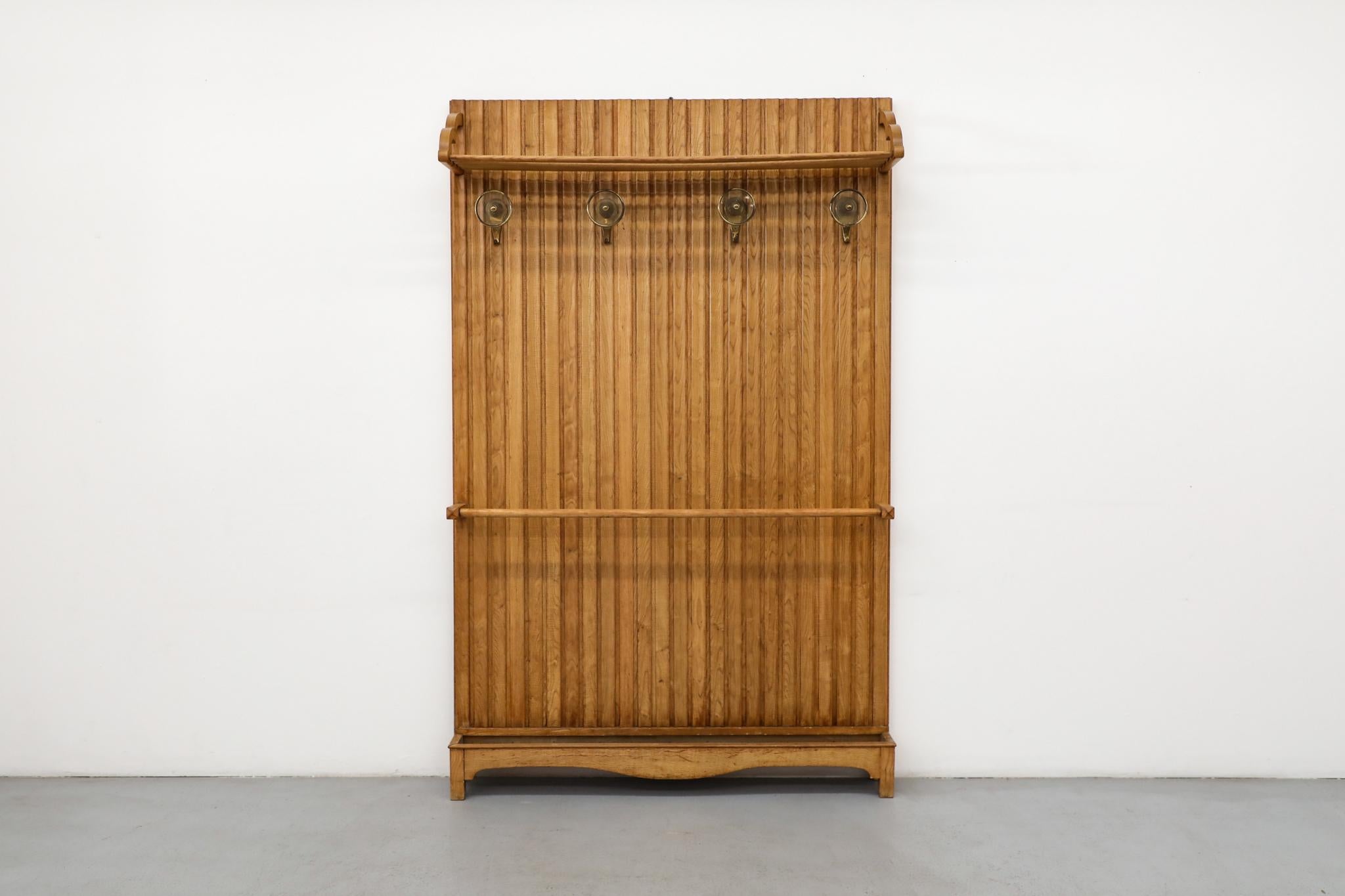 This expressive Italian entryway coat rack is a compelling piece, designed in the spirited style of Mid-Century master Gio Ponti. It captures the unique Post-War period of Italian design, which favored light, architectural forms and inventive