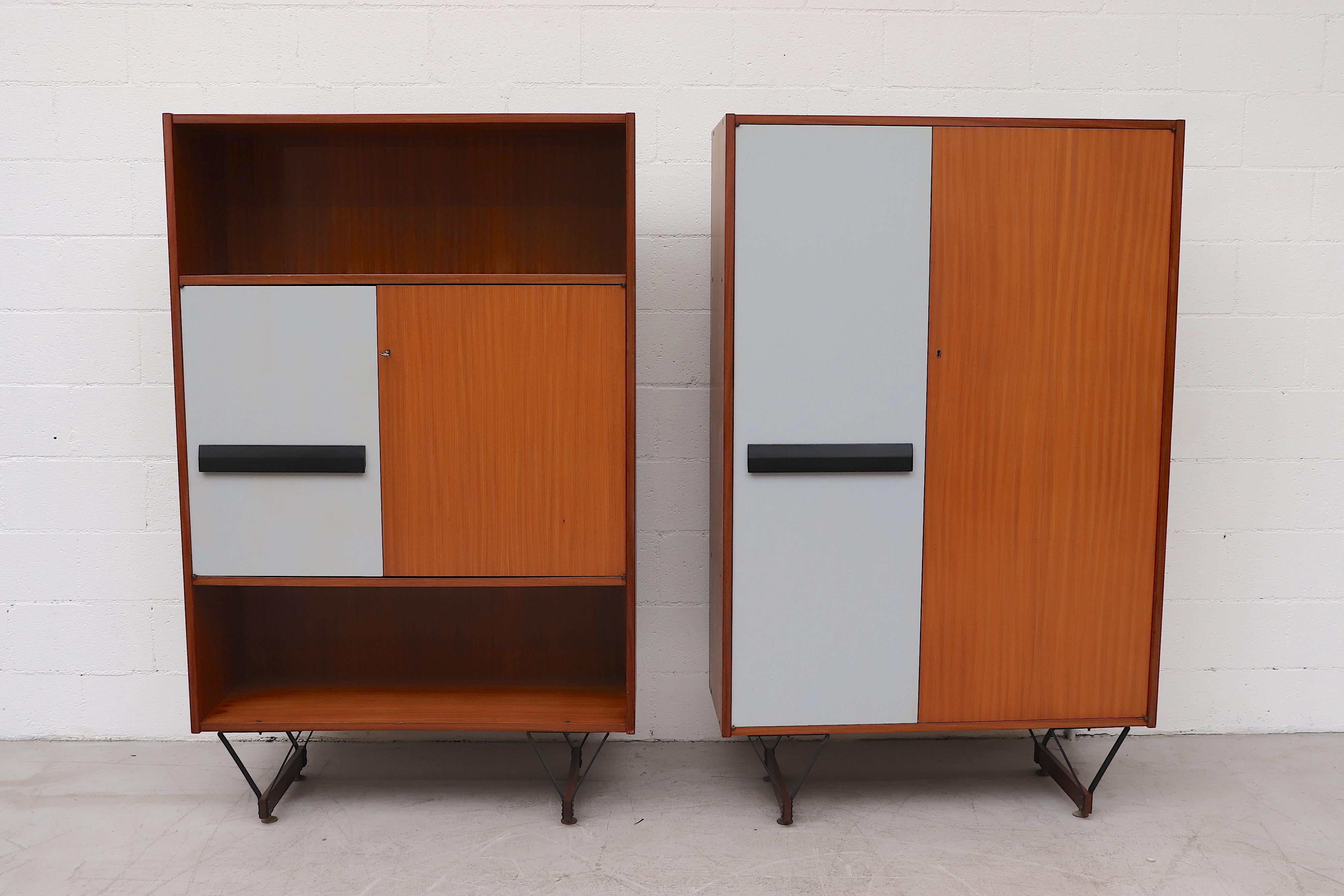 Stunning midcentury Italian wardrobe cabinet with double doors, one in teak, the other with a painted grey and a black door pull. Both open to built-in storage shelves. The cabinet stands on architectural black enameled metal hairpin-like legs.