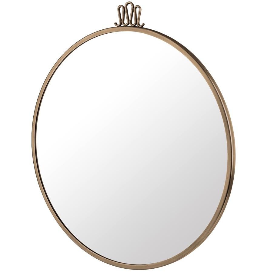 Gio Ponti large Randaccio mirror. Executed in brass and glass. Ponti created the Randaccio Mirror in 1925 for his home on Via Randaccio in Milan. Characterized by its atypical crown-like detailing on the top, a detail used by Ponti in several of his