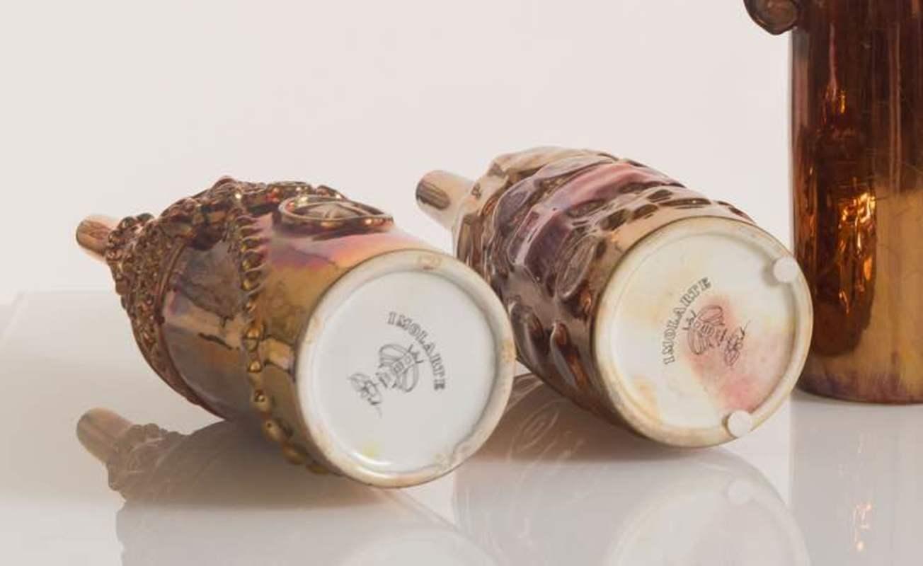 Gio Ponti, Le Bottiglie Abitate, Complete Series of five ceramic bottles in gold lustreware, Cooperativa Ceramica d'Imola Production. (Brand mark under the base)
Limited Edition from Mondello, Italy, 1950.
Measure: H36 cm (each) 

Licterature: