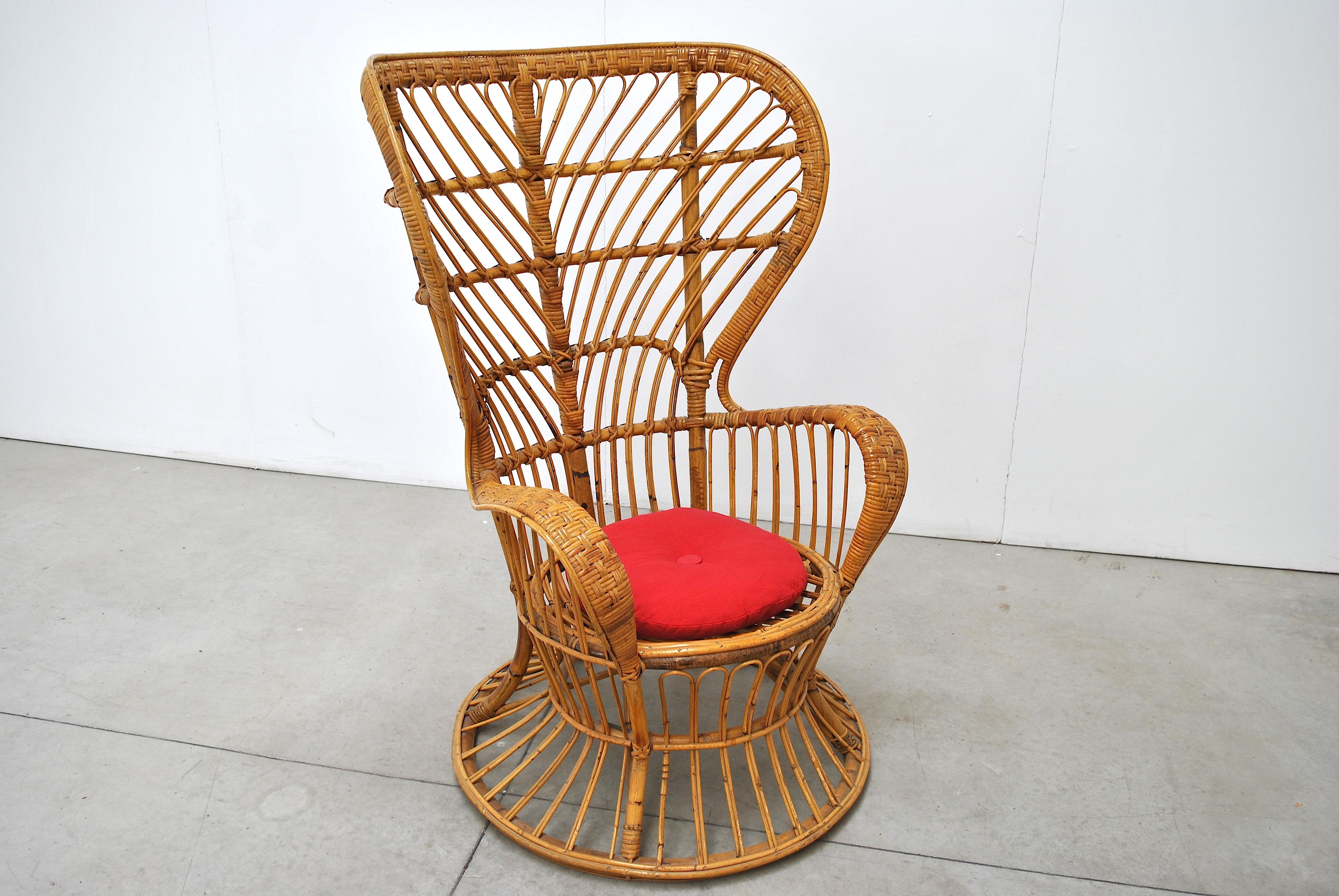 This Italian handcrafted wicker high-back armchair was designed by Lio Carminati & Gio Ponti in the 1950s and manufactured by Vittorio Bonacina. The item was specifically designed for the cruise ship Conte Biancamano.

These fabric on this chair