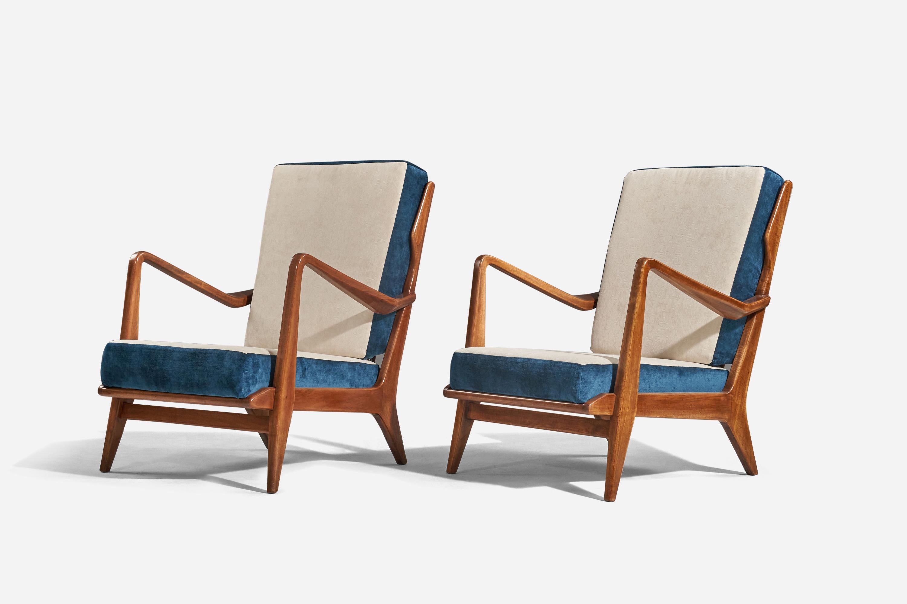 A pair of walnut and blue and white velvet lounge chairs designed by Gio Ponti and produced by Cassina, Italy, 1950s. 

With a certificate of authenticity from the Gio Ponti archives.