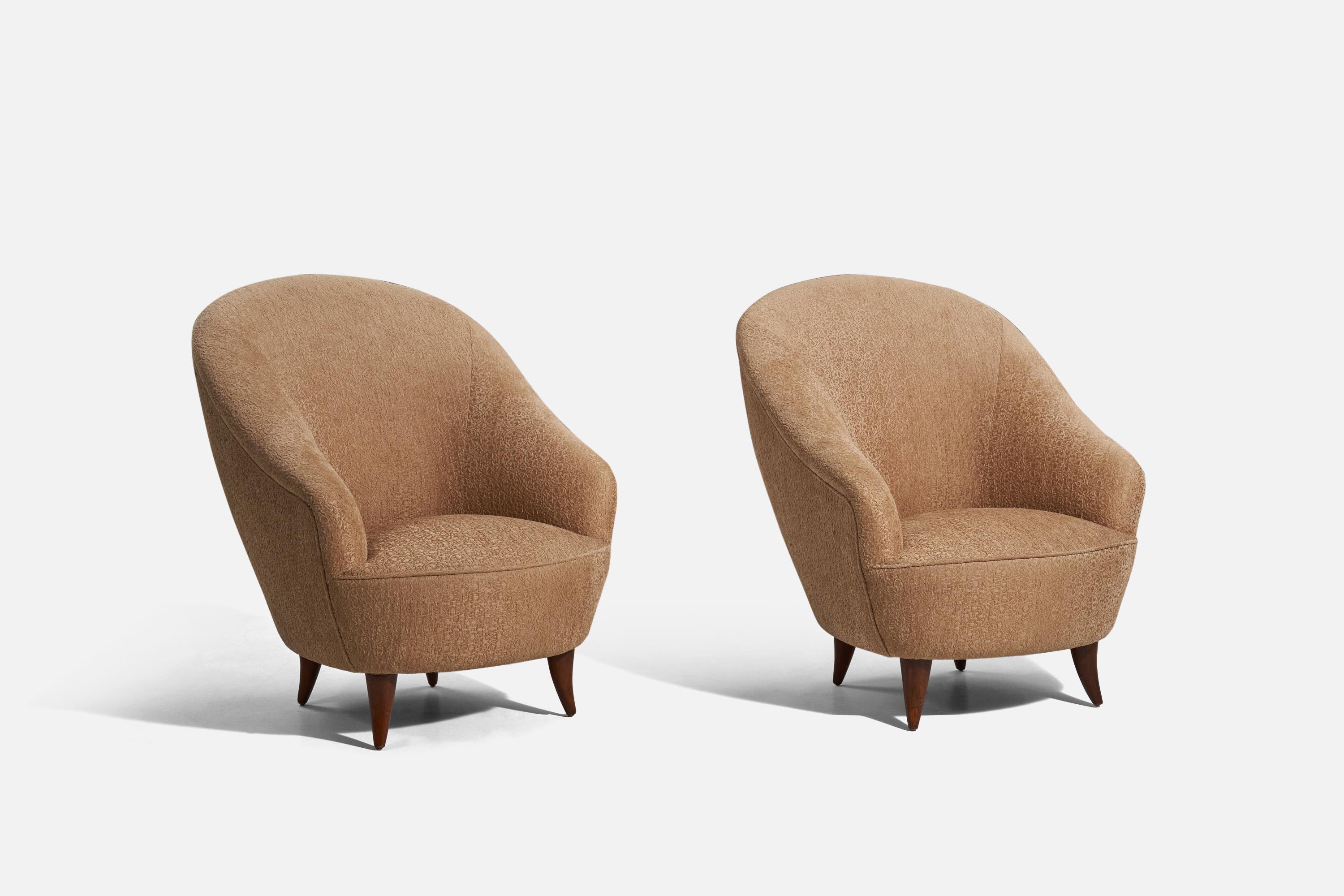 A pair of wood and fabric lounge chairs. This design was presented at the Triennale di Milano of 1936 and has been authenticated by the Gio Ponti archive.