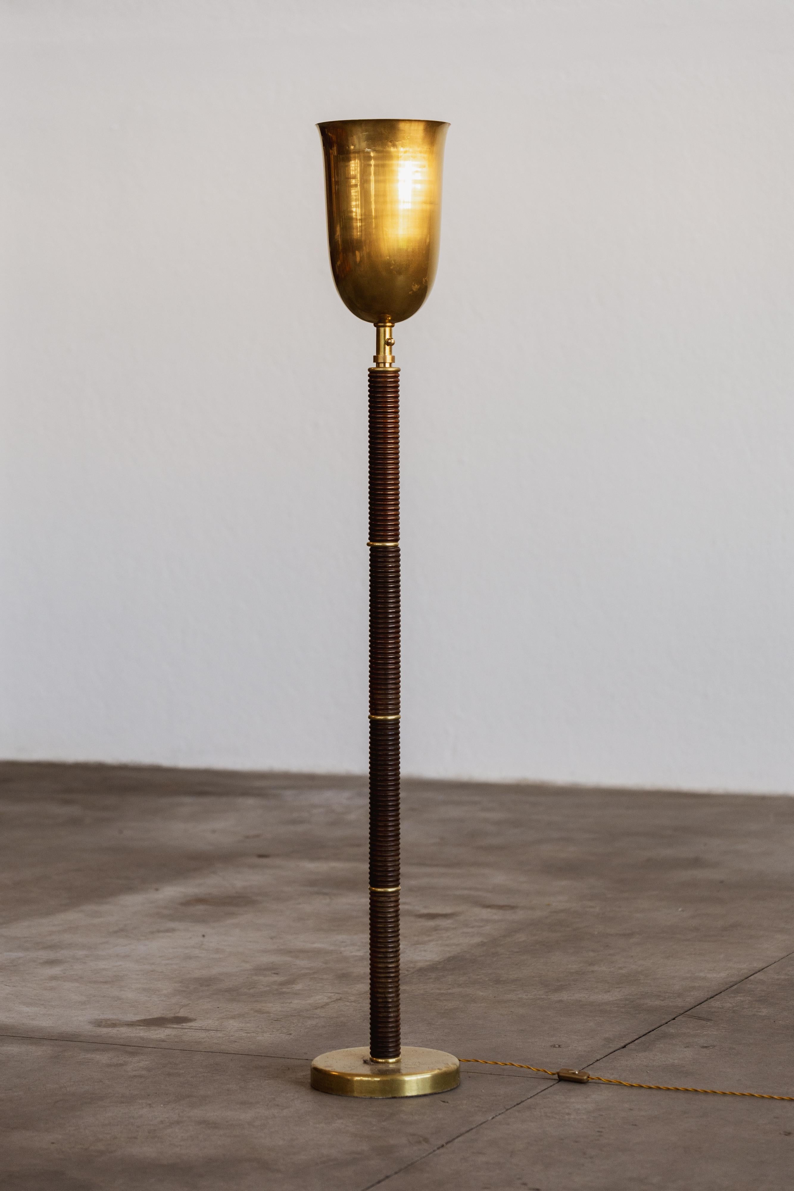 Gio Ponti “Luminator” floor lamp for Pollice, wood and brass, Italy, 1940.

The 