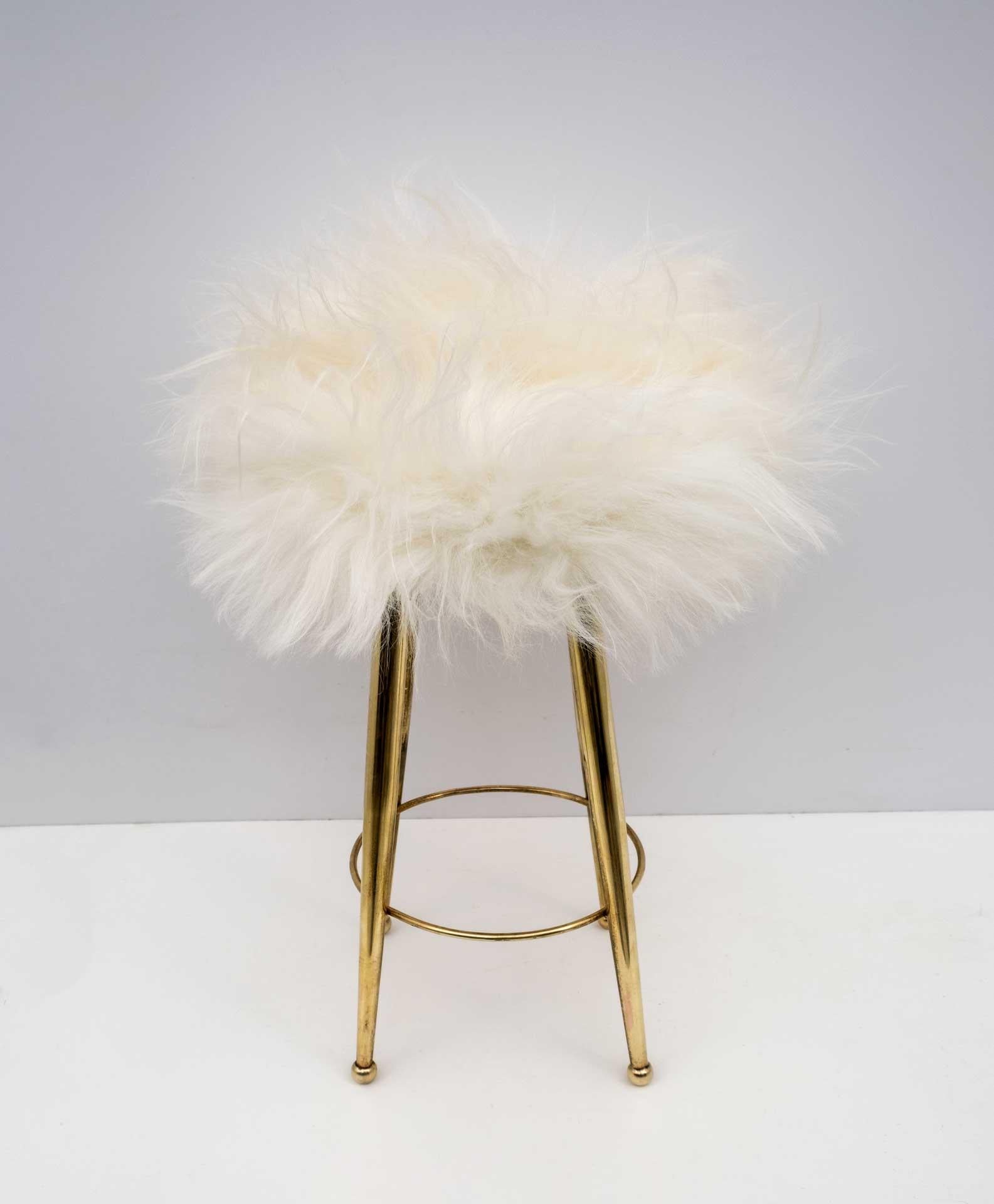 Small brass stool designed by Gio Ponti in the 1950s. Polished and upholstered in goatskin.