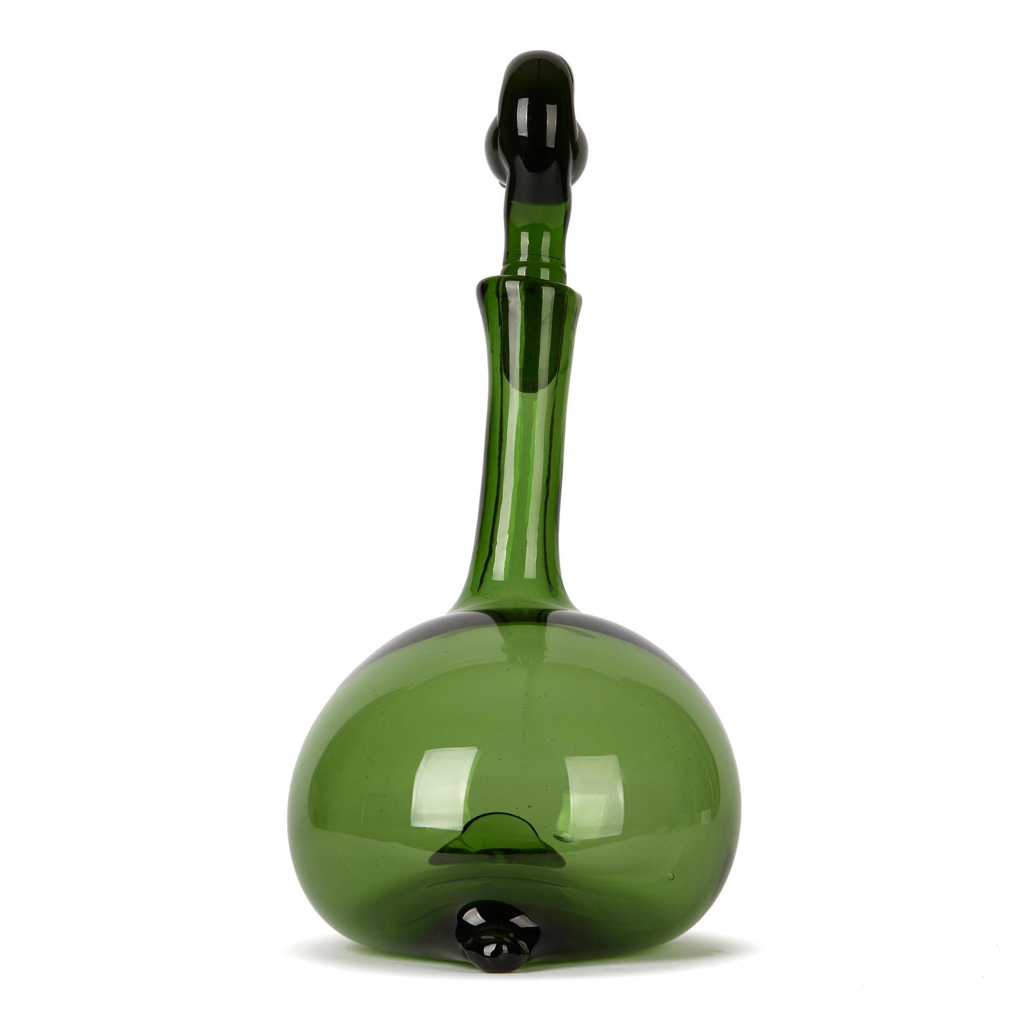 A stylish Italian Murano hand blown Empoli Verde decanter, in the shape of a duck thought to be based on the design of Gio Ponti for Taddei di Empoli around 1950 produced circa 1960 by acclaimed glass makers Toso Bagnoli. The green glass decanter