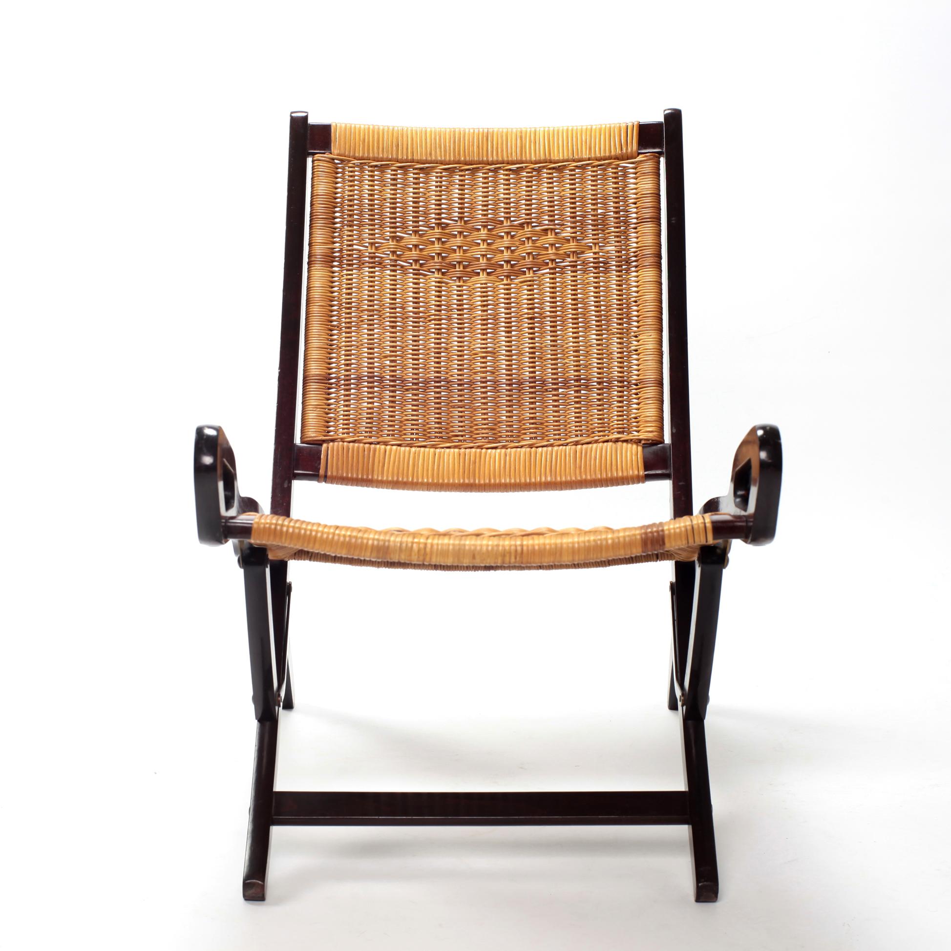 Rare Gio Ponti Ninfea folding chair for Fratelli Reguitti.
Italy 1950s, beech, original caning. 
Brevetti Fratelli Reguitti Stamp.
Literature: Gio Ponti: The Complete Work 1923-1978, Licitra Ponti, p. 286.
