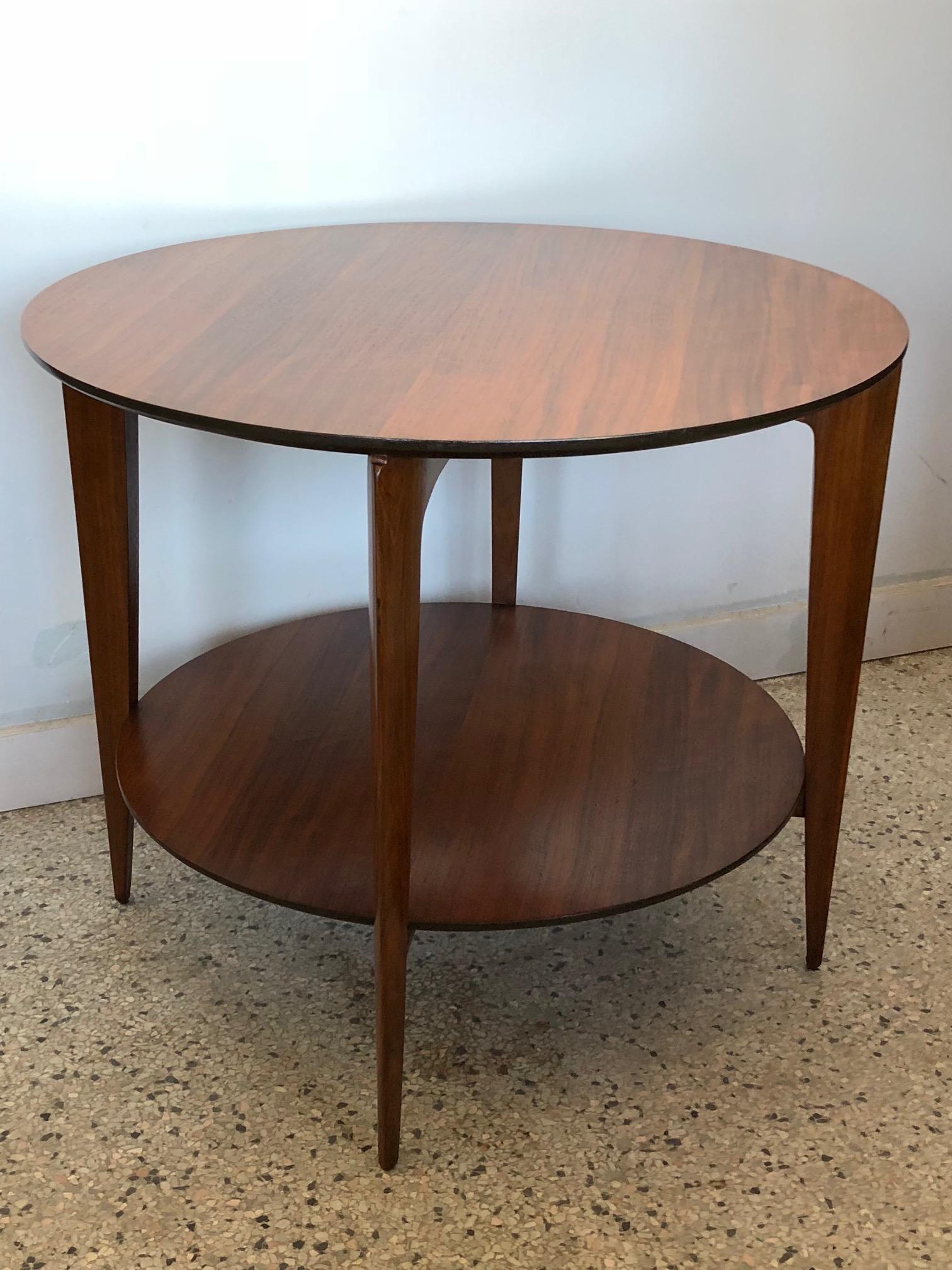 An occasional two-tiered table by Gio Ponti for Singer & Sons, circa 1950s. Manufactured in Italy by Giordano Chiesa this table is well documented in the G.Ponti archives and 