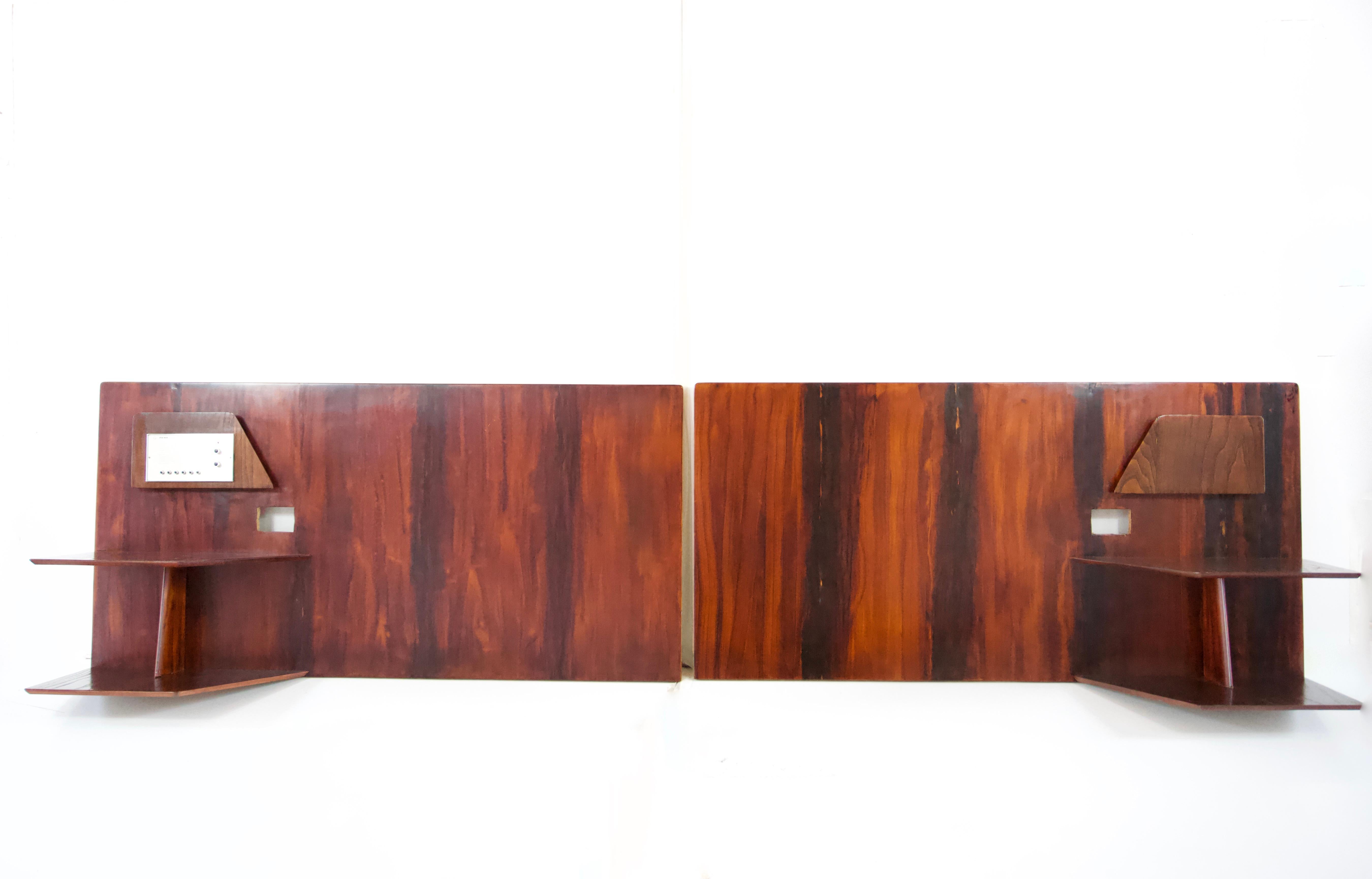A pair of headboards by Gio Ponti from the furniture of the Hotel Royal in Naples, 1955.
Manufactured by Giordano Chiesa by Dassi.
flamed walnut, finish mahogany  and metal
two tiered shelving, magazine rack, space for lighting and two radio unit (