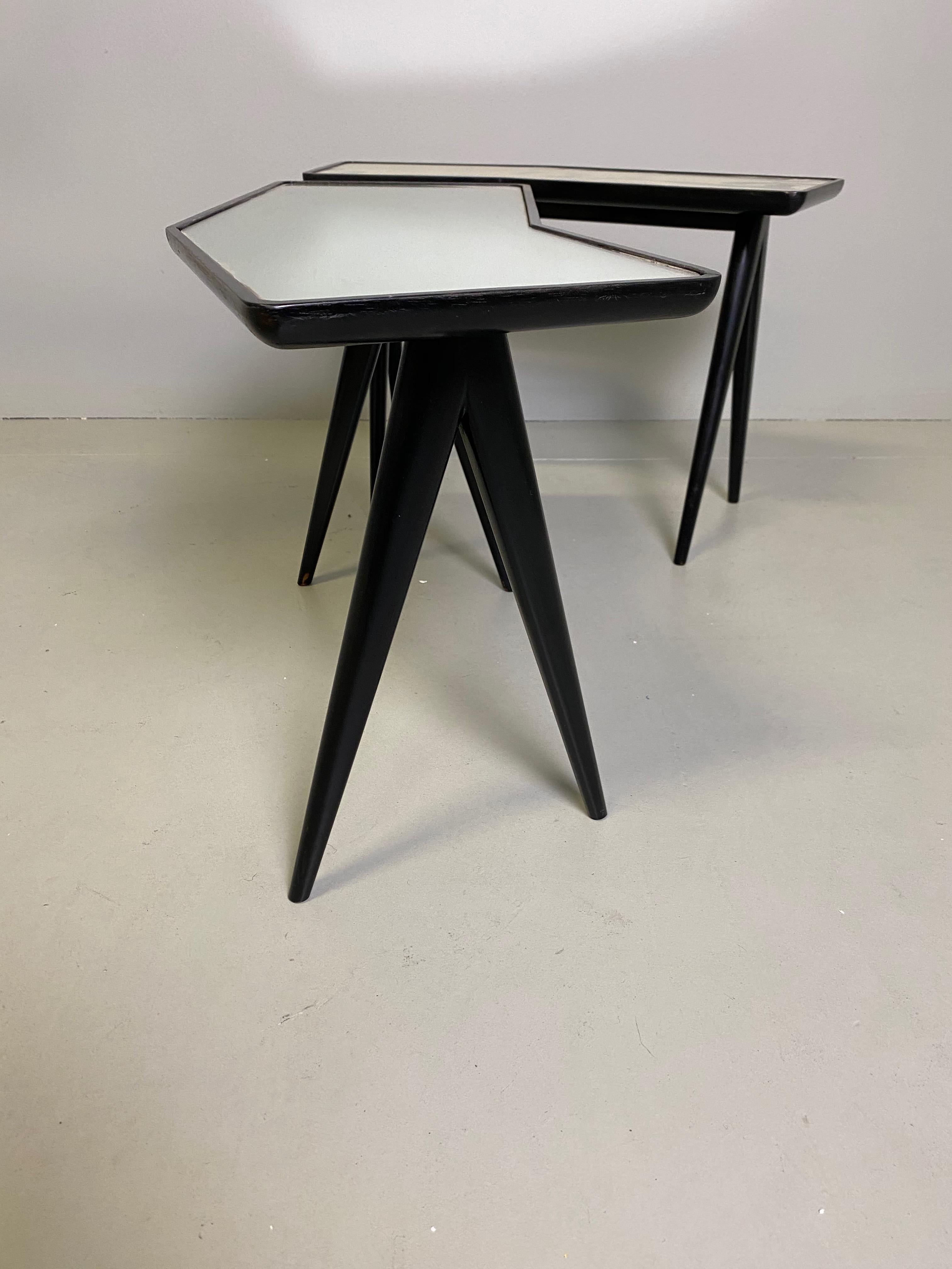 Pair of Italian master architect Gio Ponti black lacquered walnut side tables with mirrored glass tops by Pietro Chiesa. 
 From the circa 1960s.