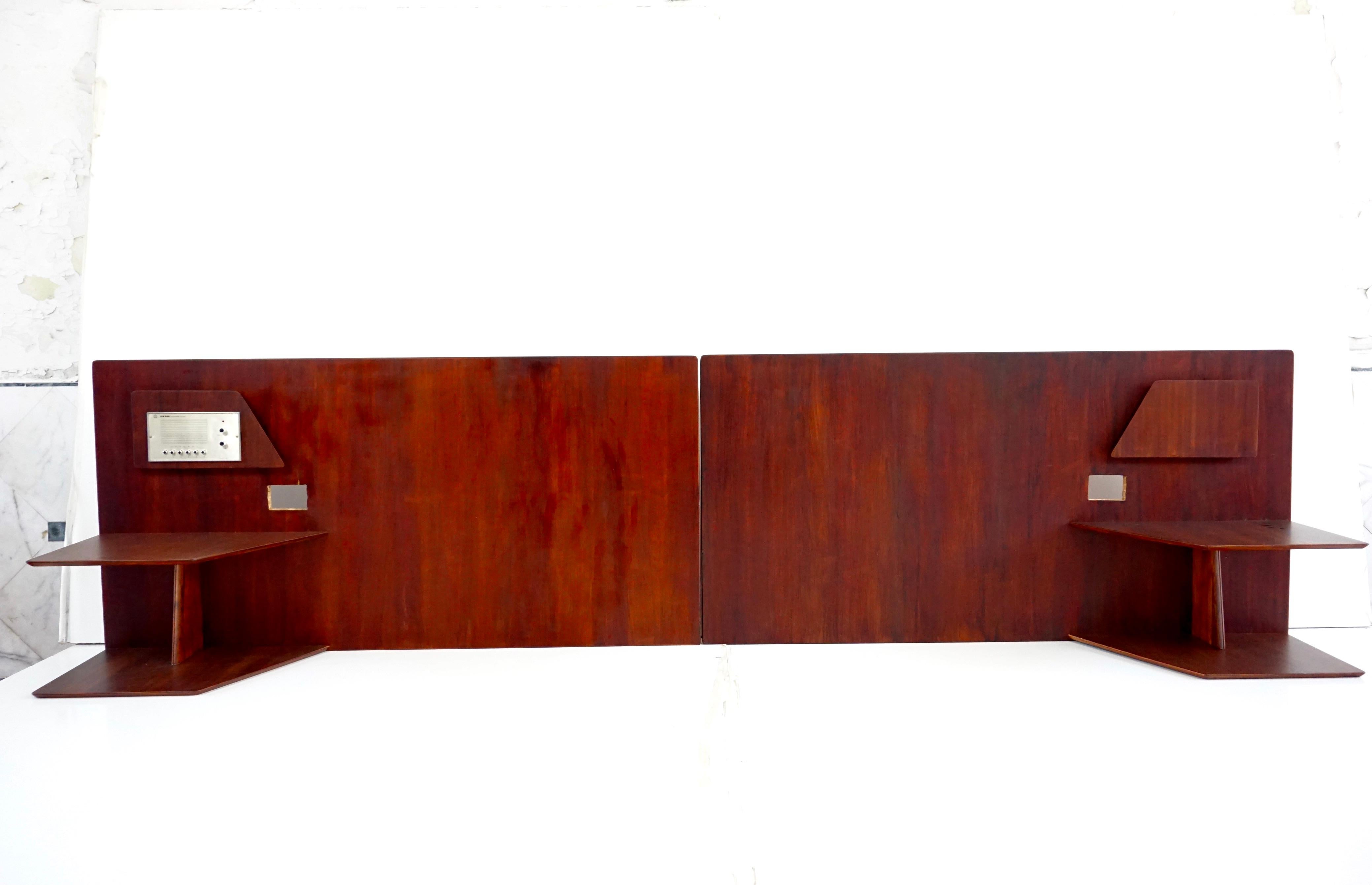 A pair of headboards by Gio Ponti from the furniture of the Hotel Royal in Naples, 1955.
Manufactured by Giordano Chiesa by Dassi.
walnut  and metal
two tiered shelving, magazine rack, space for lighting and two radio unit ( not working).
Good