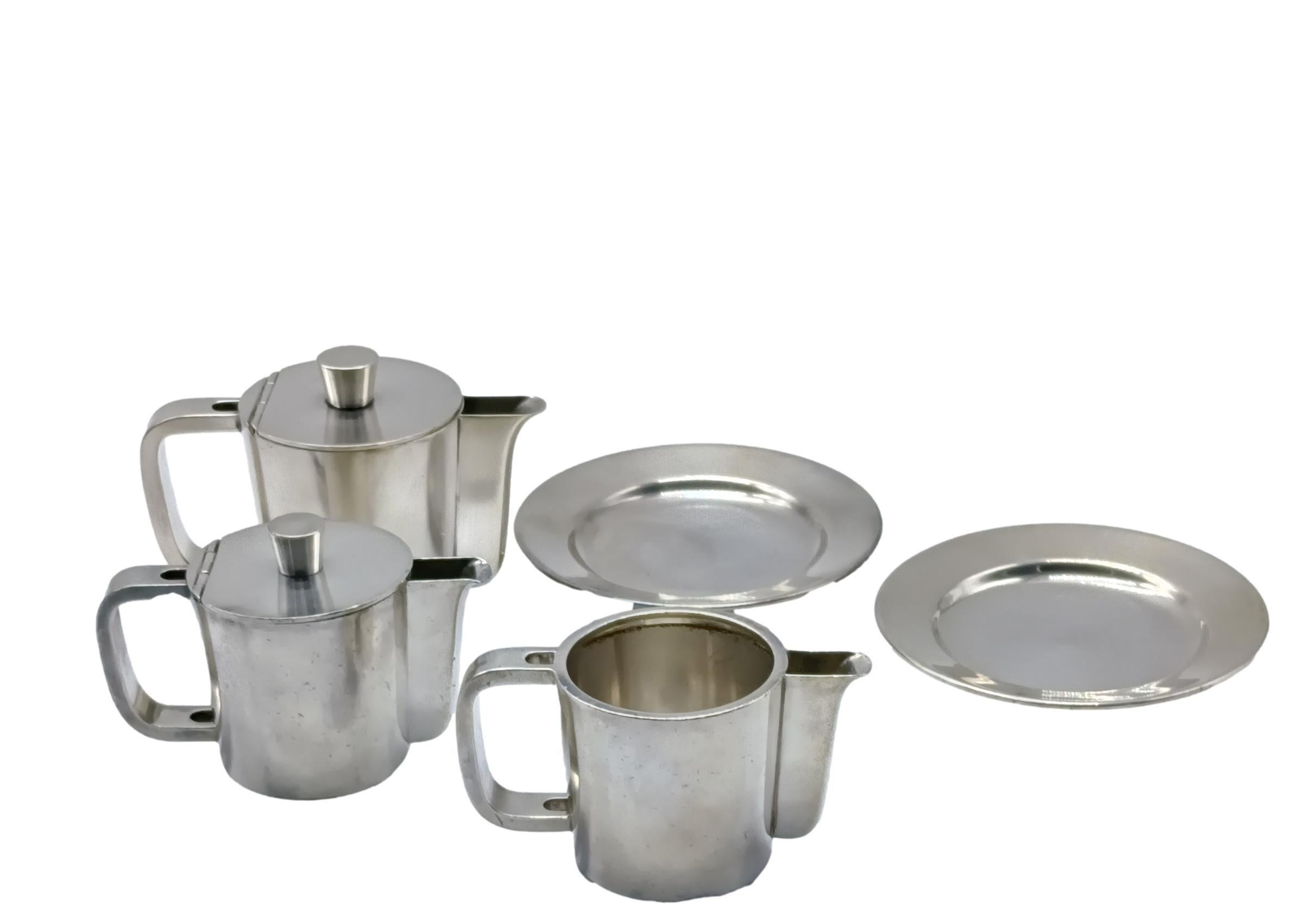 A set of two nickel silver coffee pots , 2 saucers and a milk jug designed by Gio Ponti and manufactured by Krupp Milan in the 1950s. They were used in hotels and are marked on the bottom with the words Krupp Milan. The objects embody the elegance,